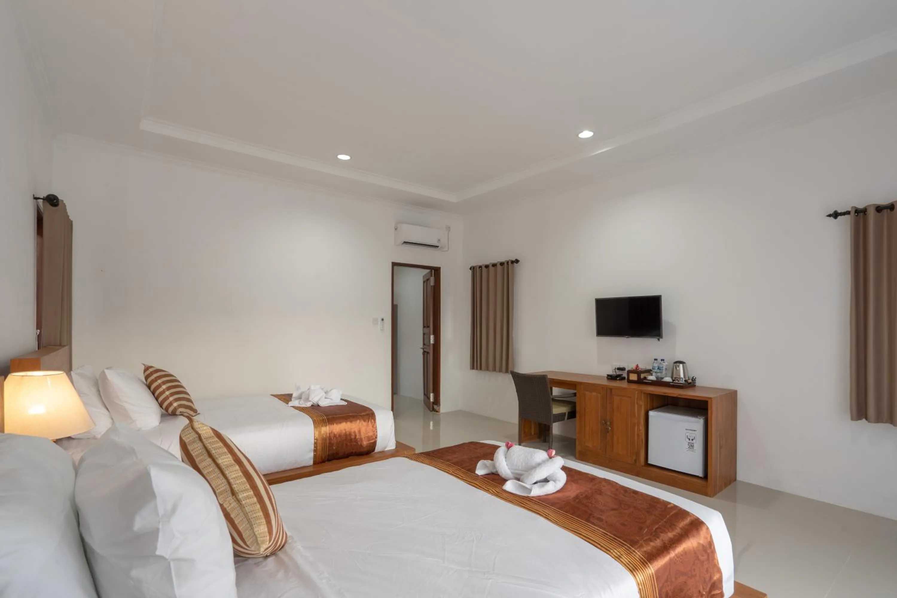 Bed in Nusa Indah Onai Hotel