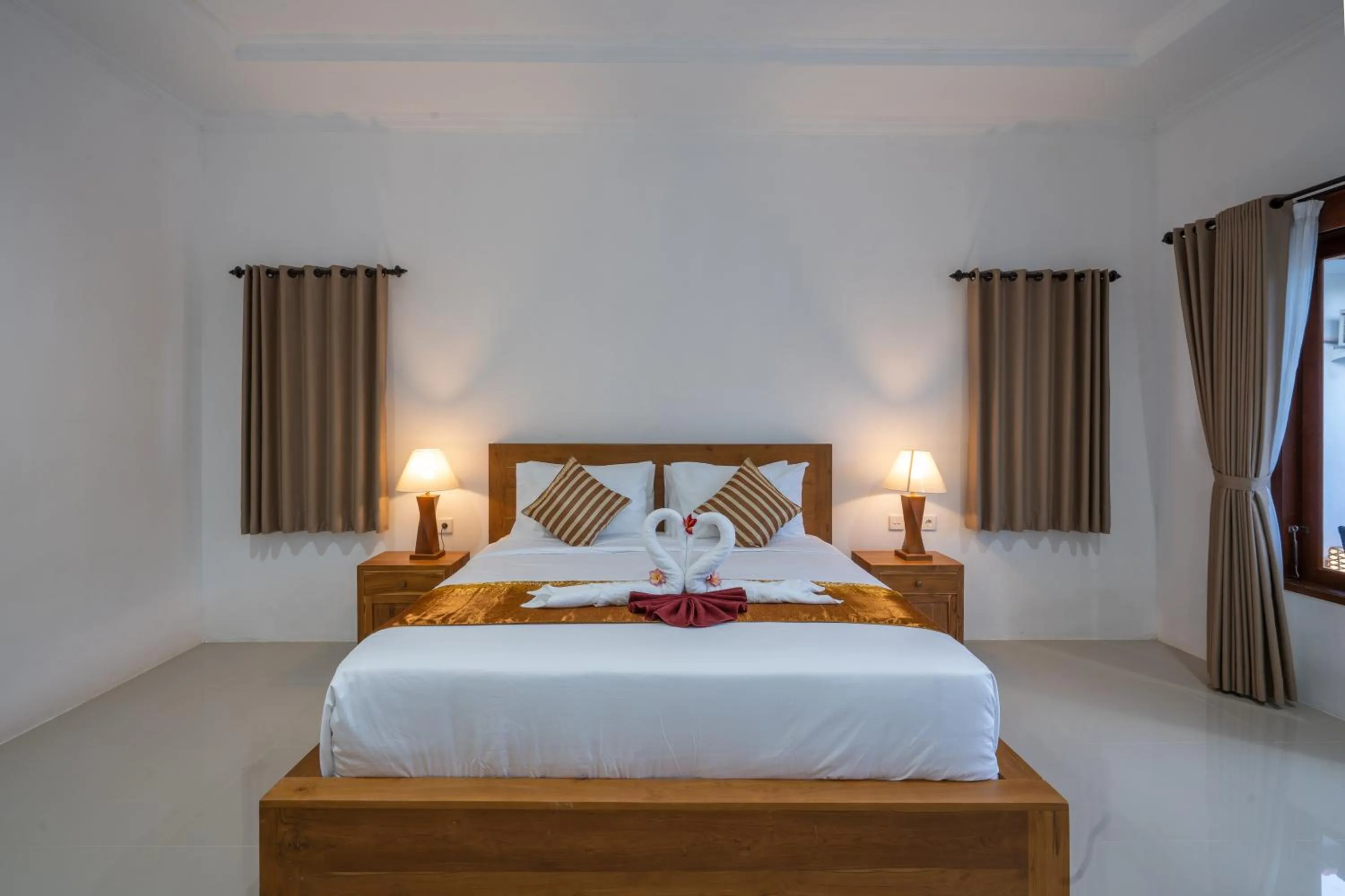 Bed in Nusa Indah Onai Hotel