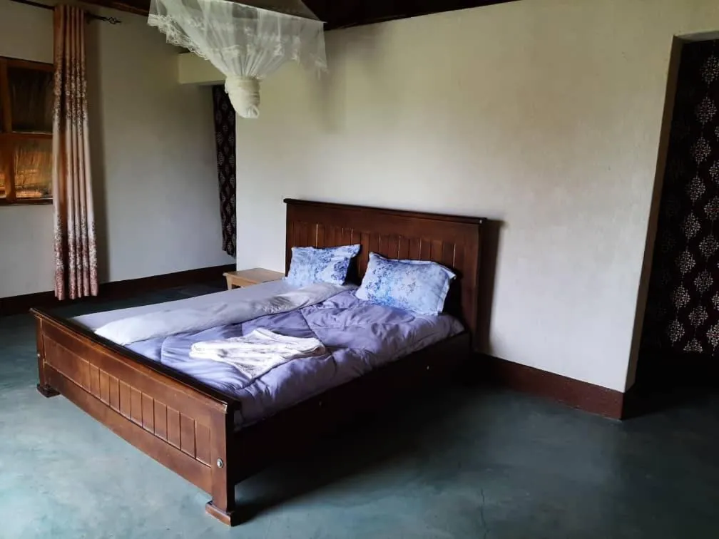 Photo of the whole room, Bed in Tangi Safari Lodge