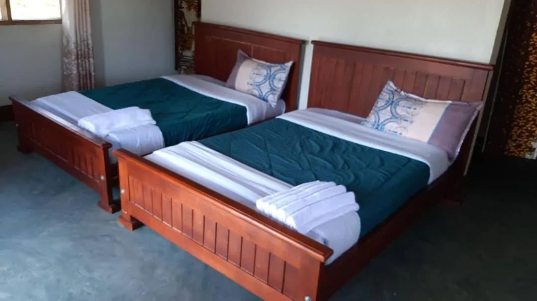 Bed in Tangi Safari Lodge