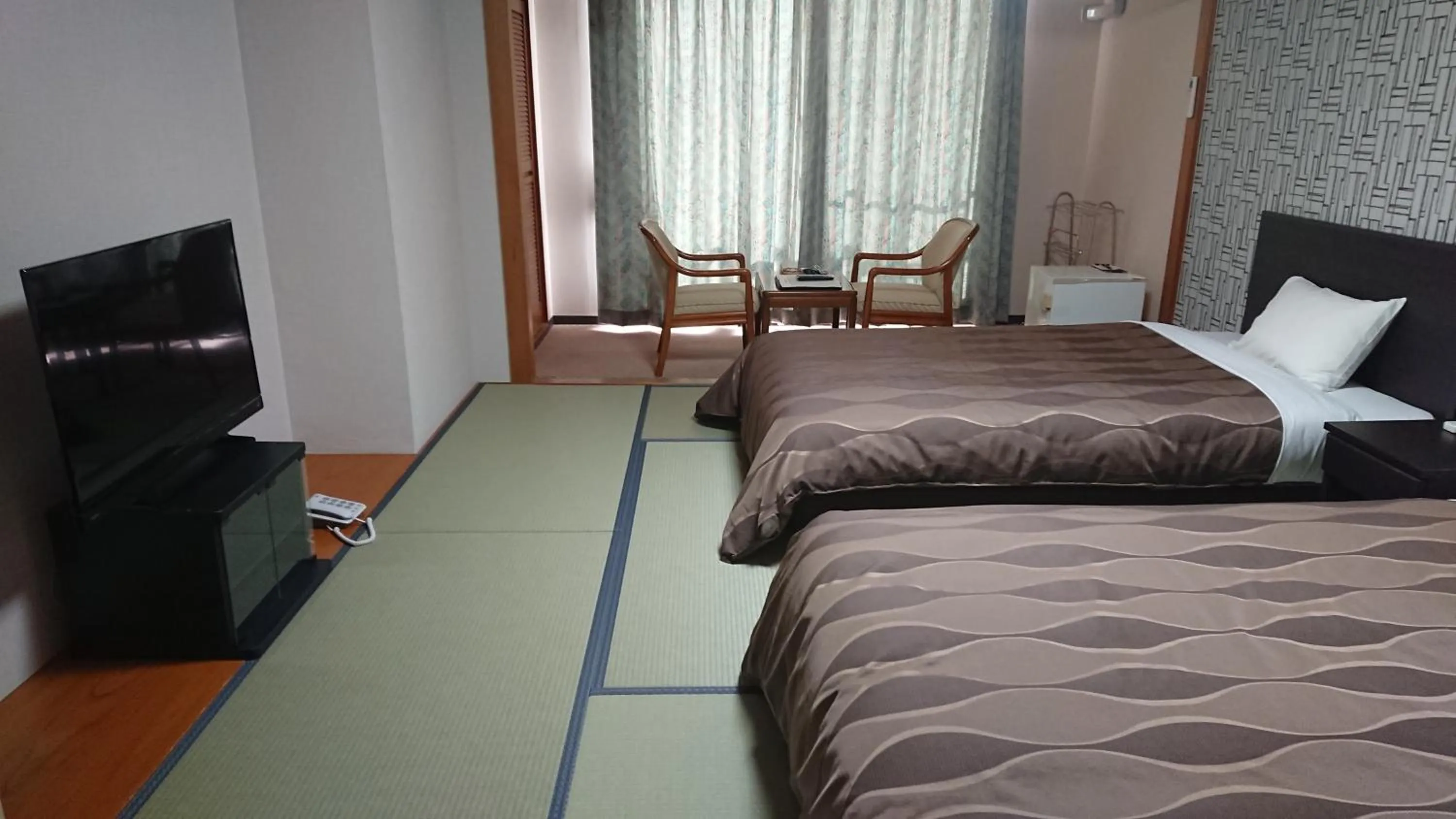 Bed in The Gran Resort Arima