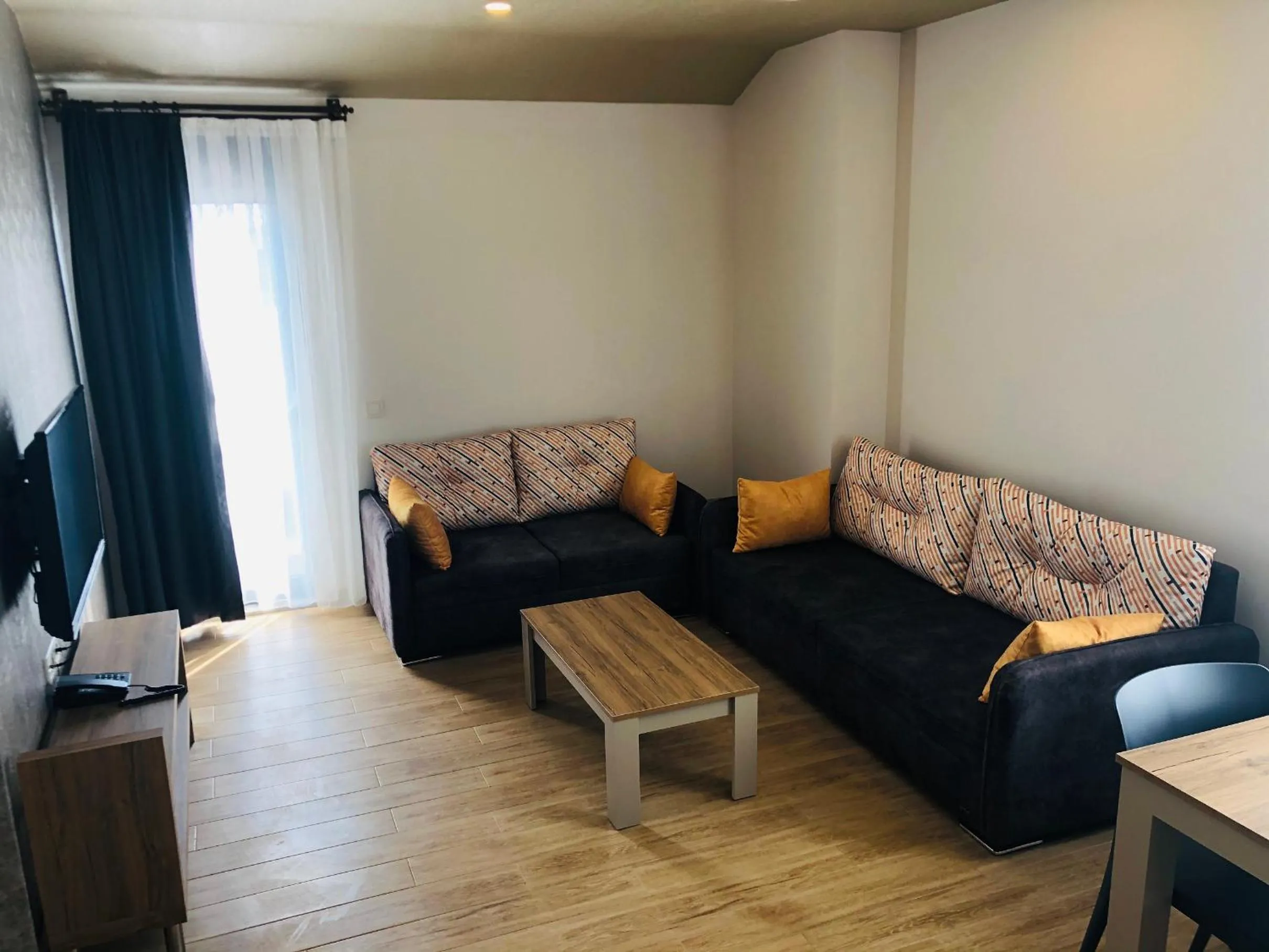 Living room in Golden World Suite Hotel