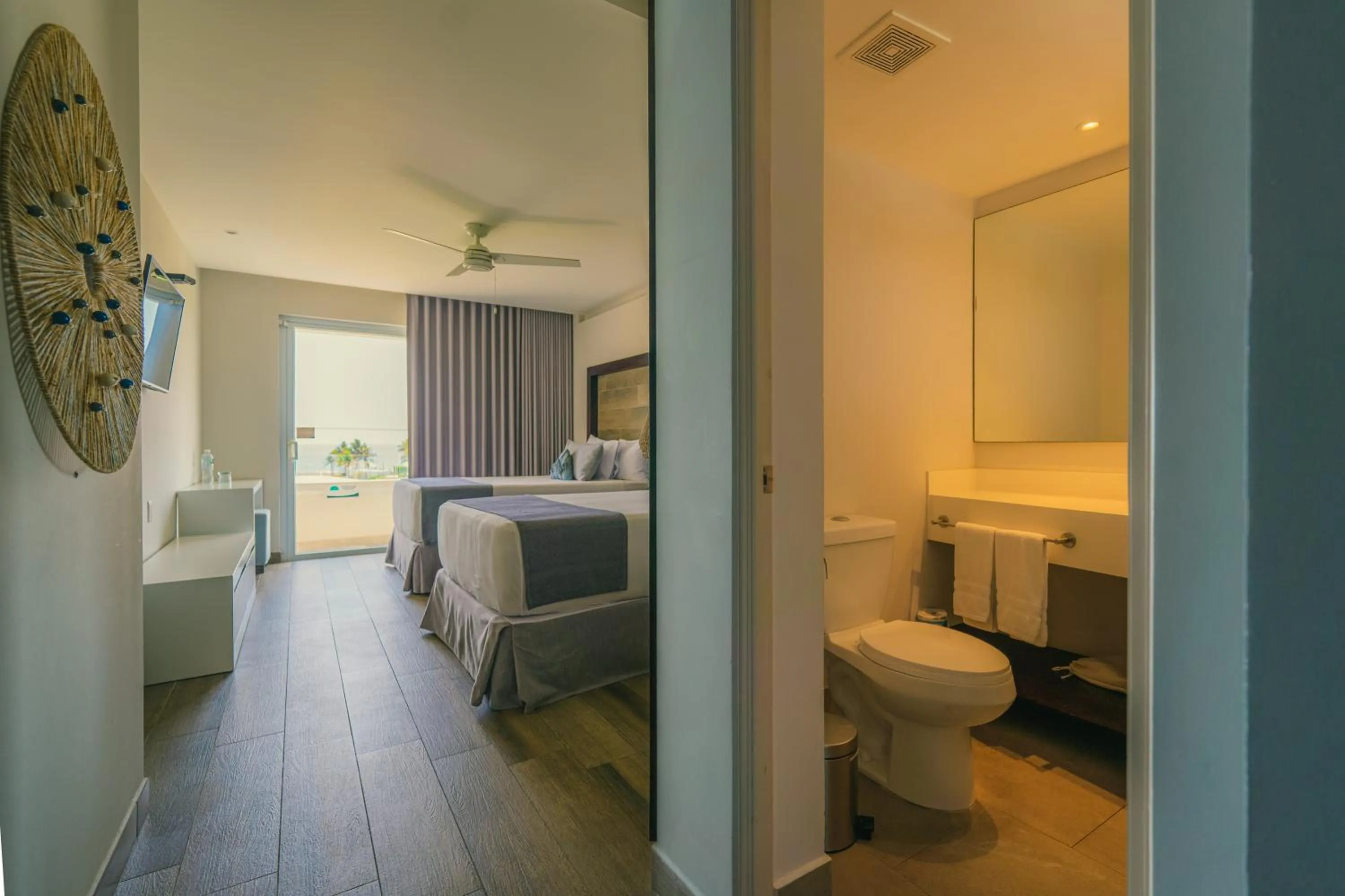 Toilet, Bed in Oceana Resort & Conventions