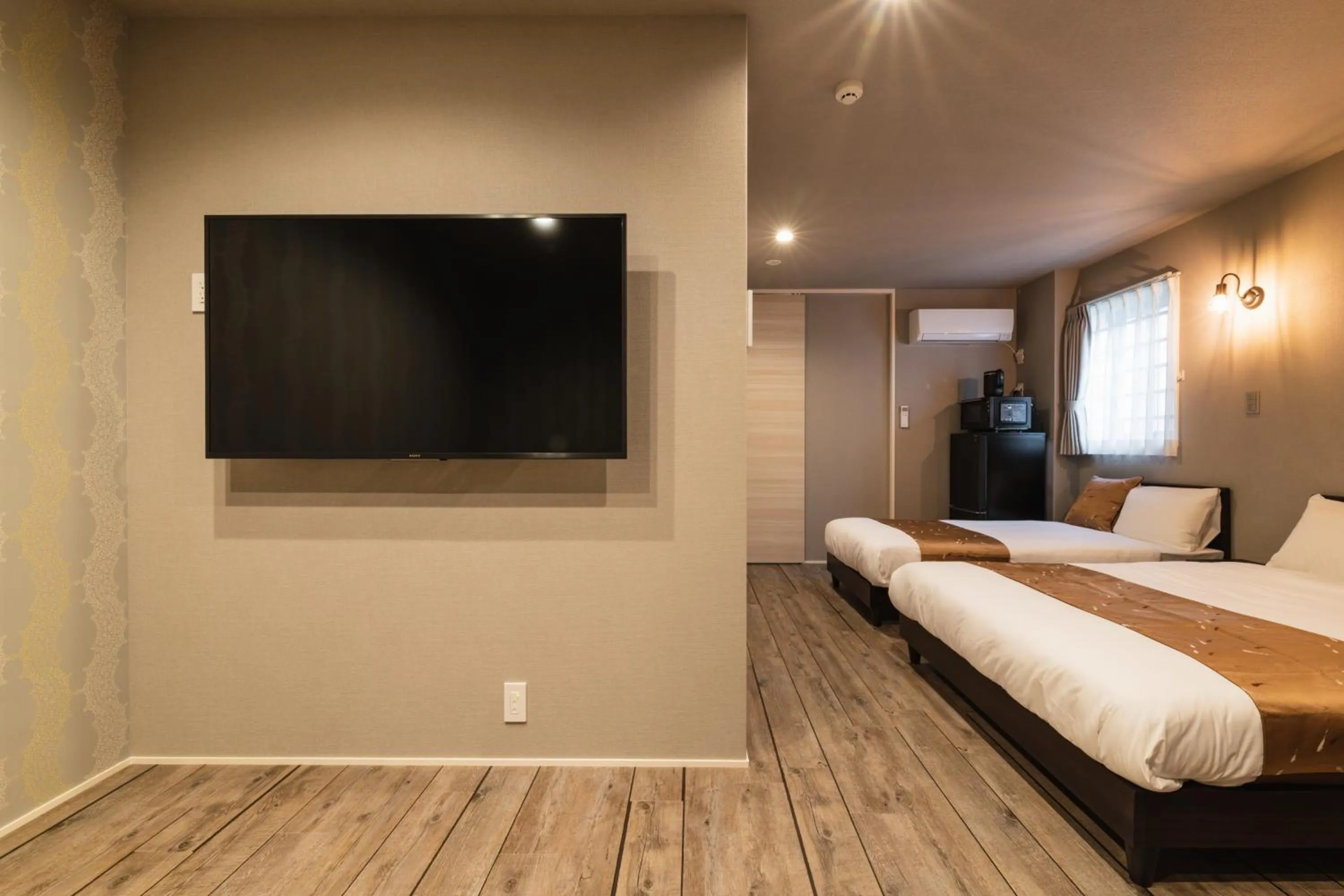 Photo of the whole room, Bed in GRAND BASE Nagasaki City