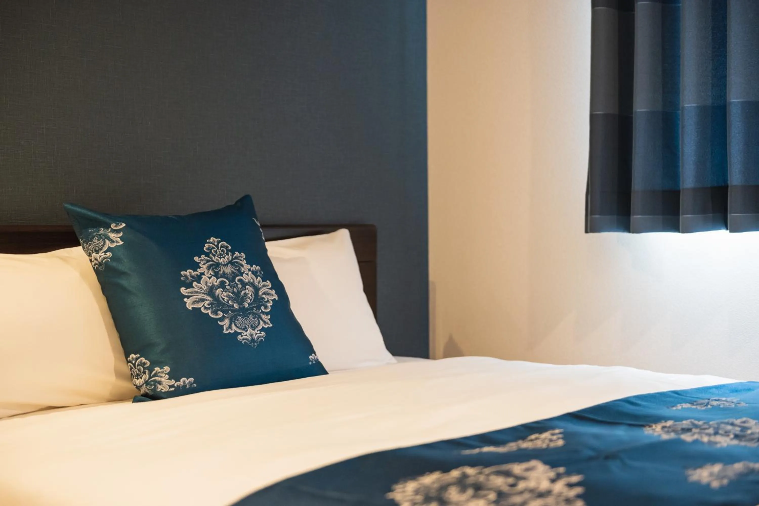 Bed in GRAND BASE Nagasaki City