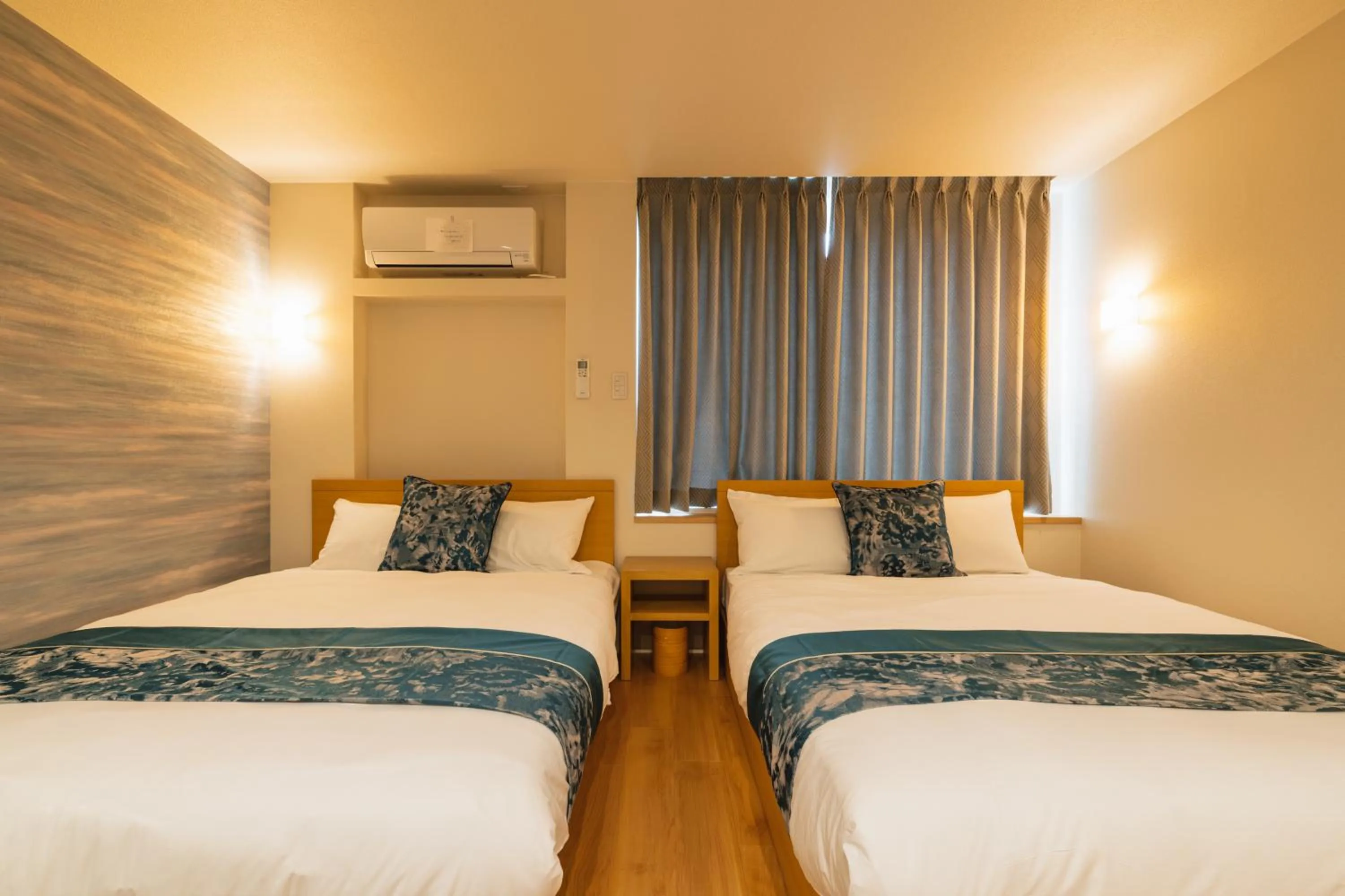 Bed in GRAND BASE Nagasaki City