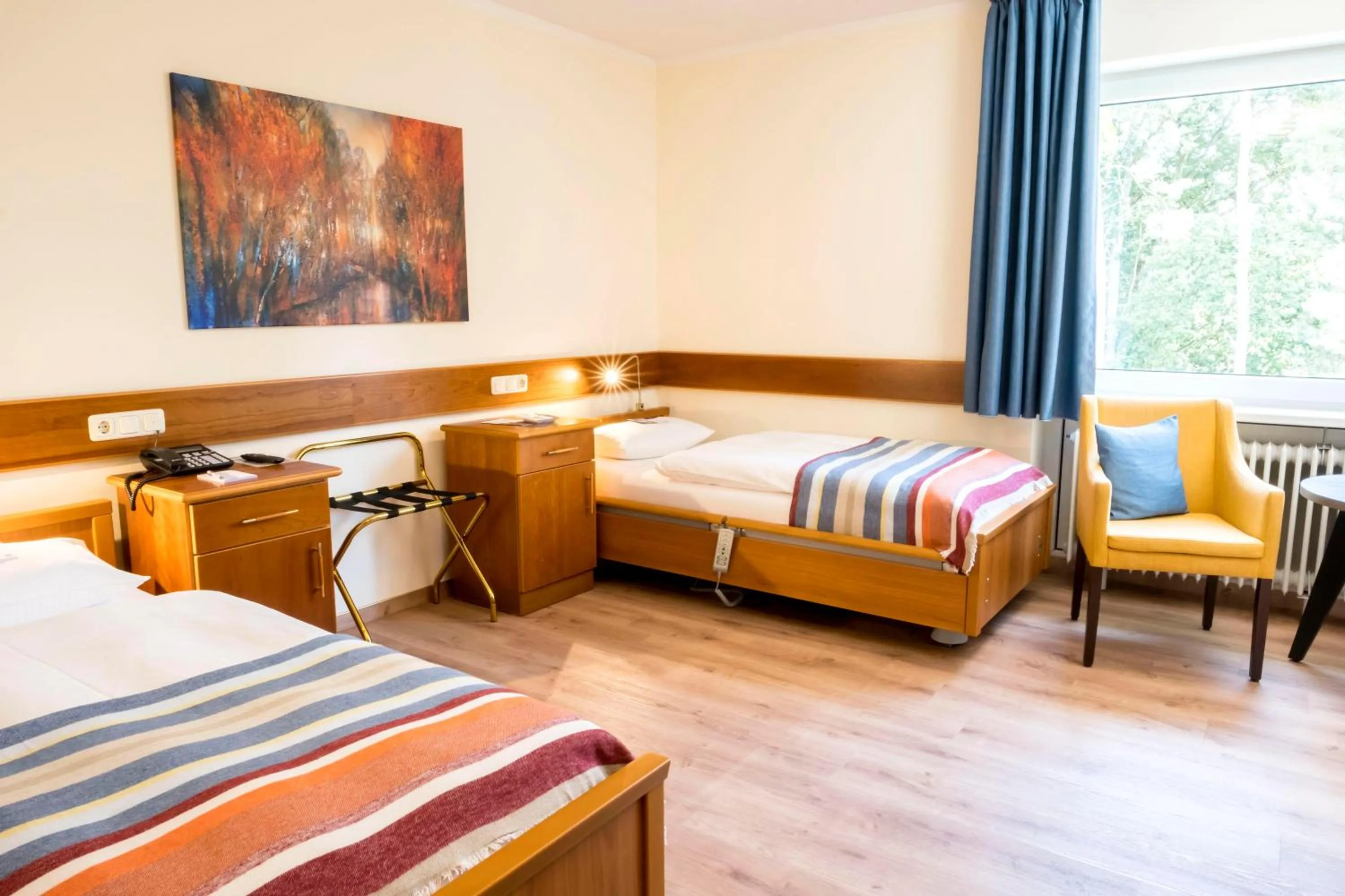 Photo of the whole room, Bed in Heidehotel Bad Bevensen