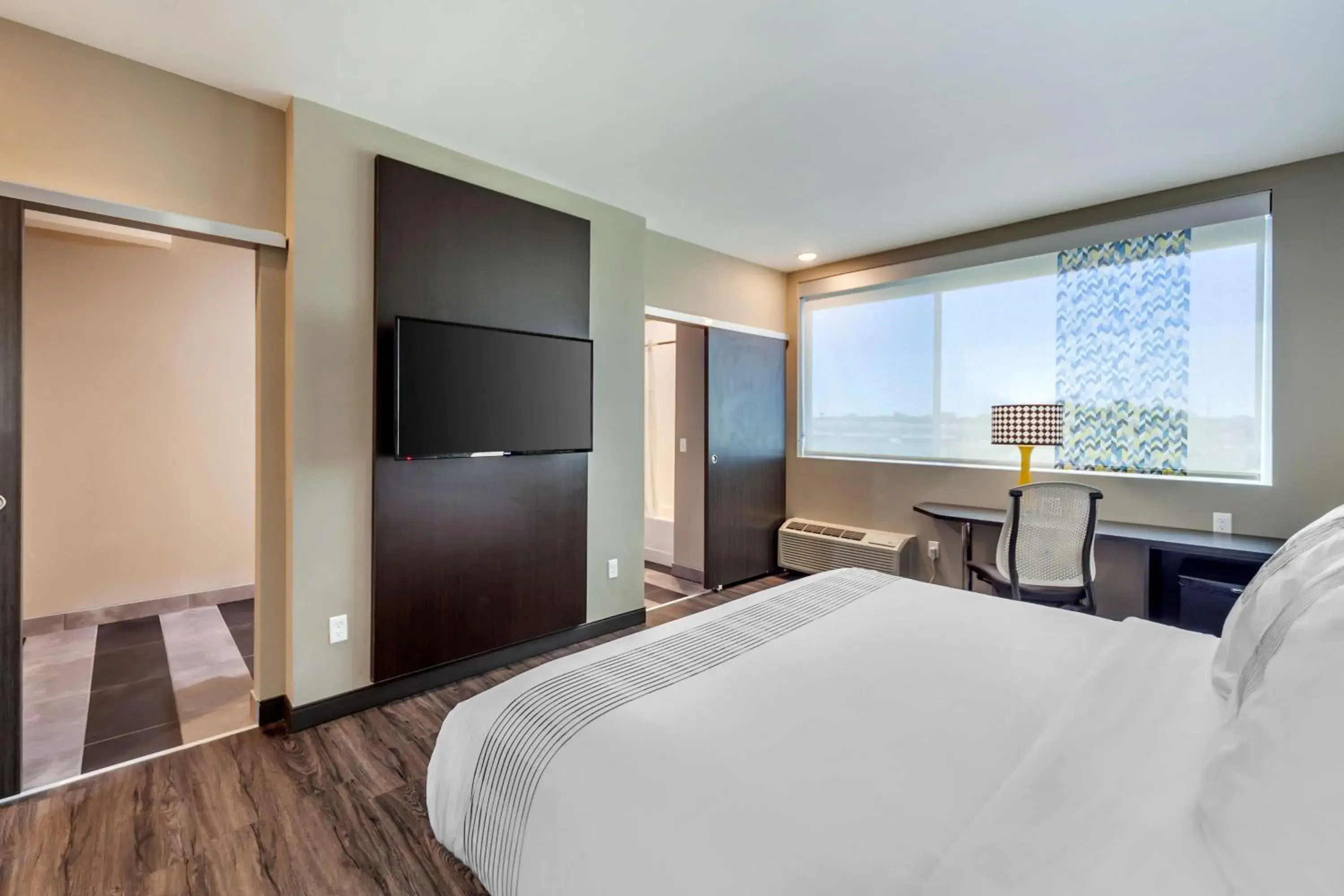 Larger King Room with Mobility Accessible Roll-In Shower in GLō Best Western Dawley Farms In Sioux Falls Larger King Room with Mobility Accessible Roll-In Shower in GLō Best Western Dawley Farms In Sioux Falls