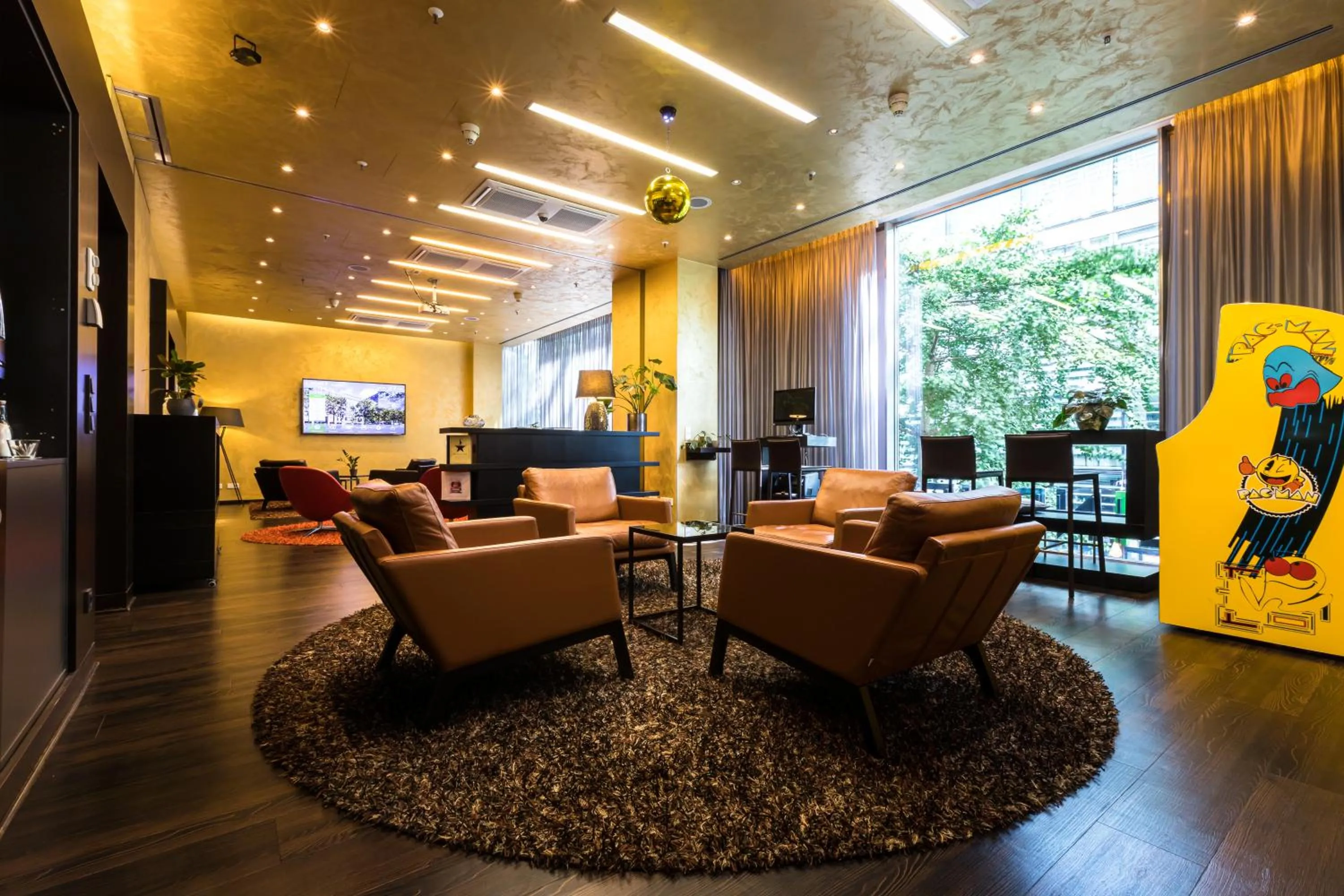 Communal lounge/ TV room in Lindner Hotel Berlin Ku'damm, part of JdV by Hyatt