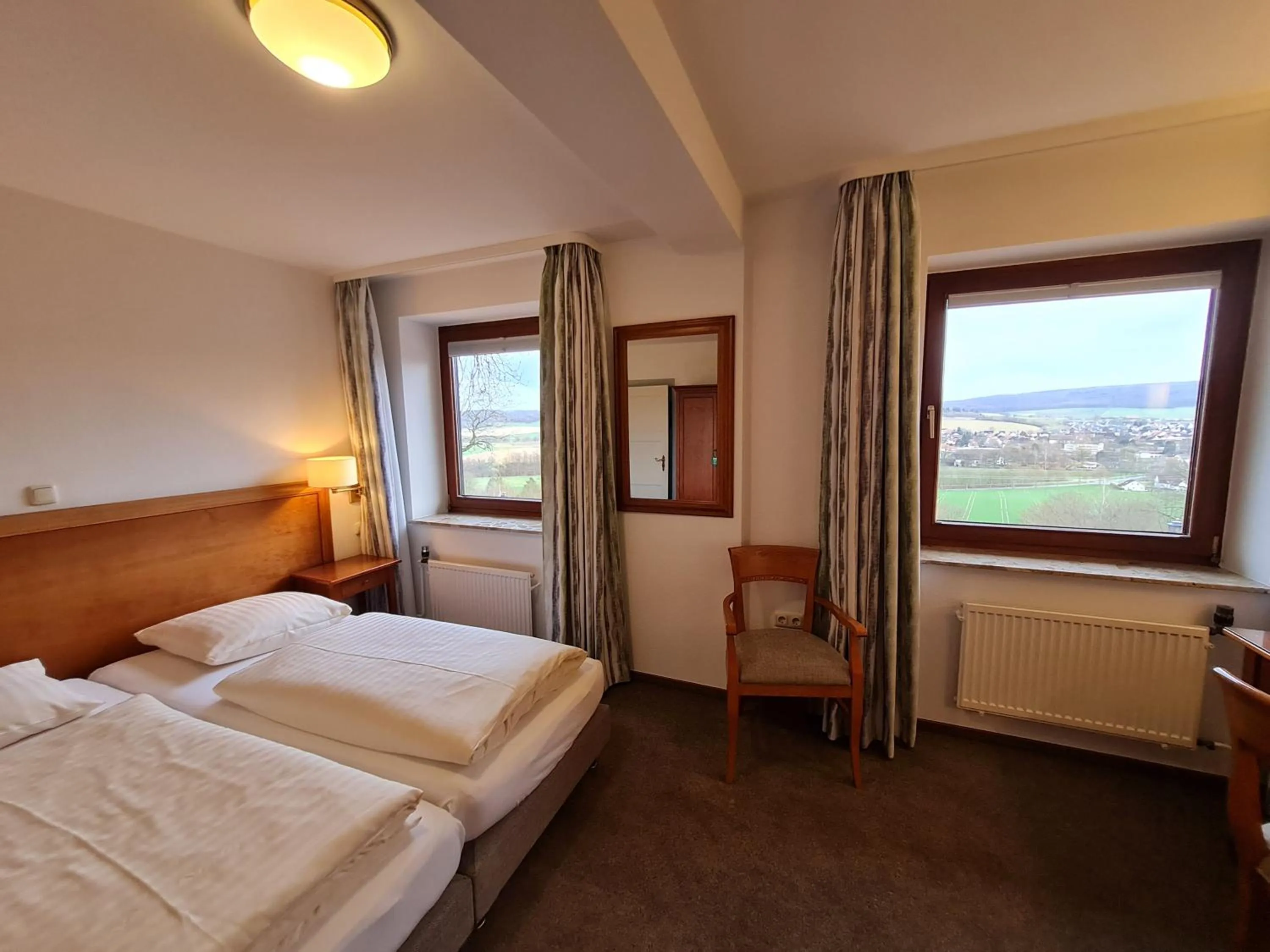 View (from property/room), Bed in Hotel Waldquelle - Baumhaushotel Aerzen