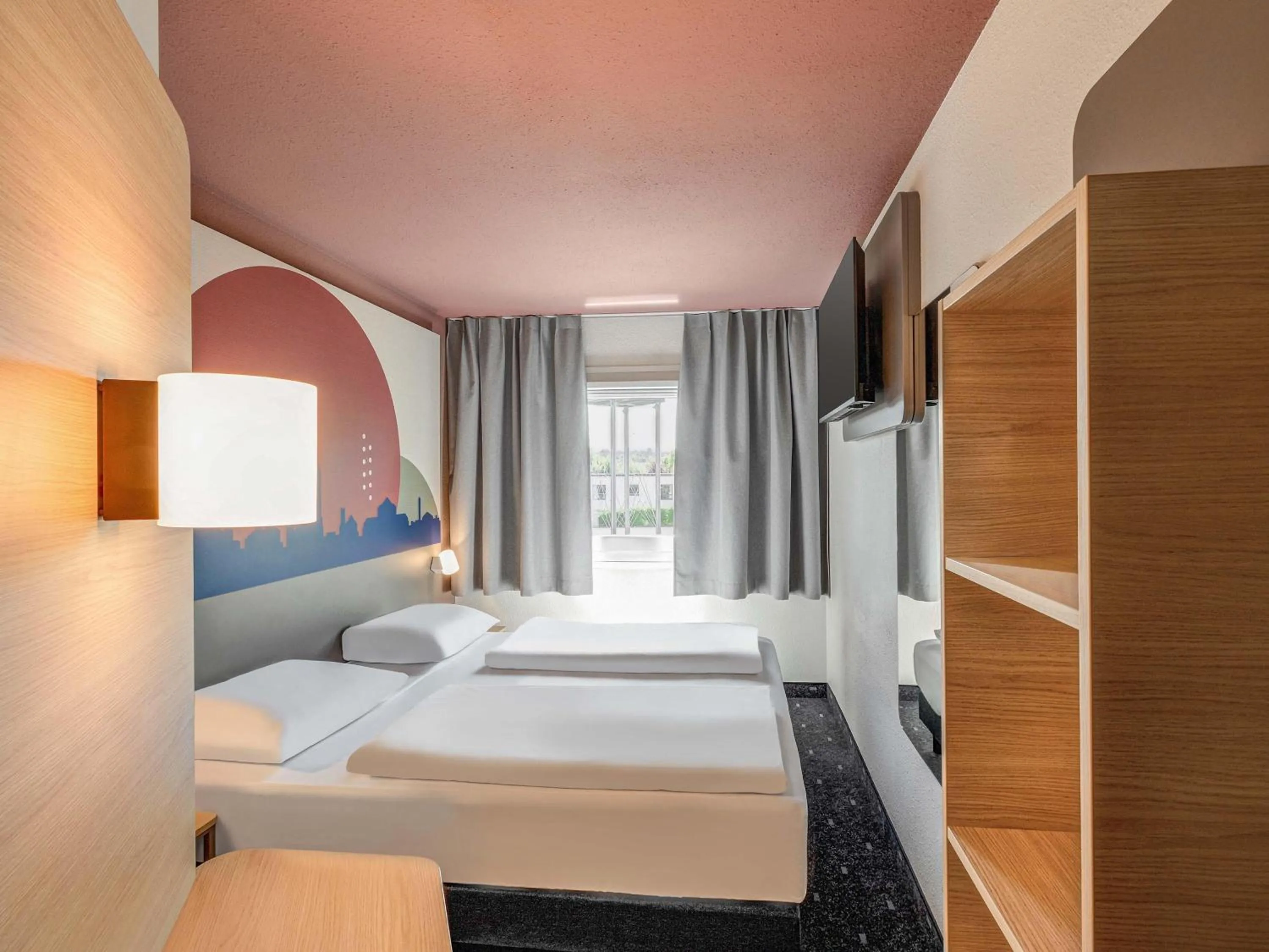 Photo of the whole room, Bed in B&B HOTEL Kassel-Lohfelden