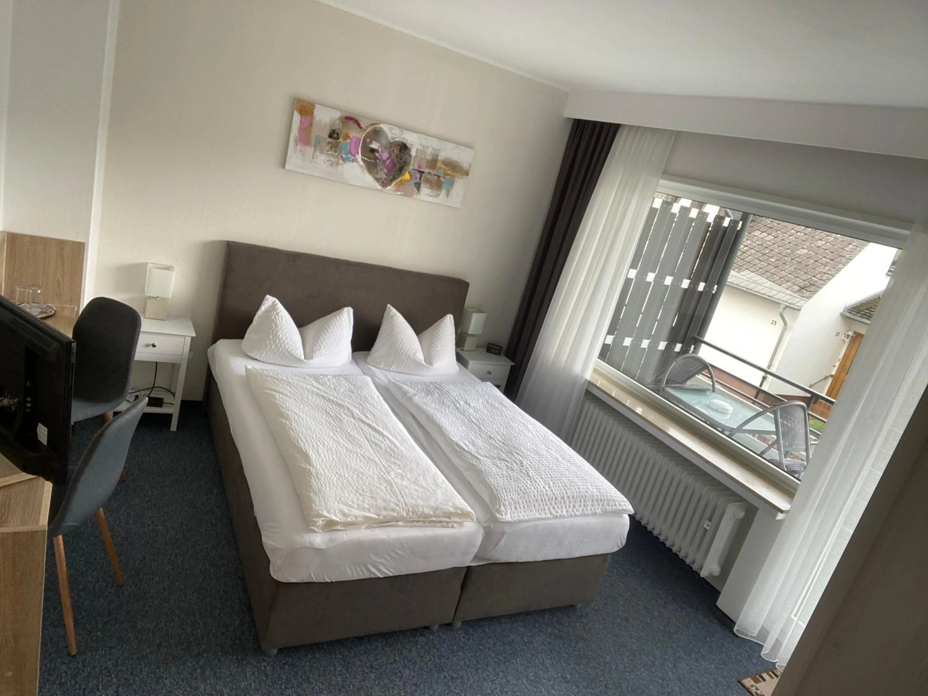 Bed in Sevda's Hotel Garni Weinforth