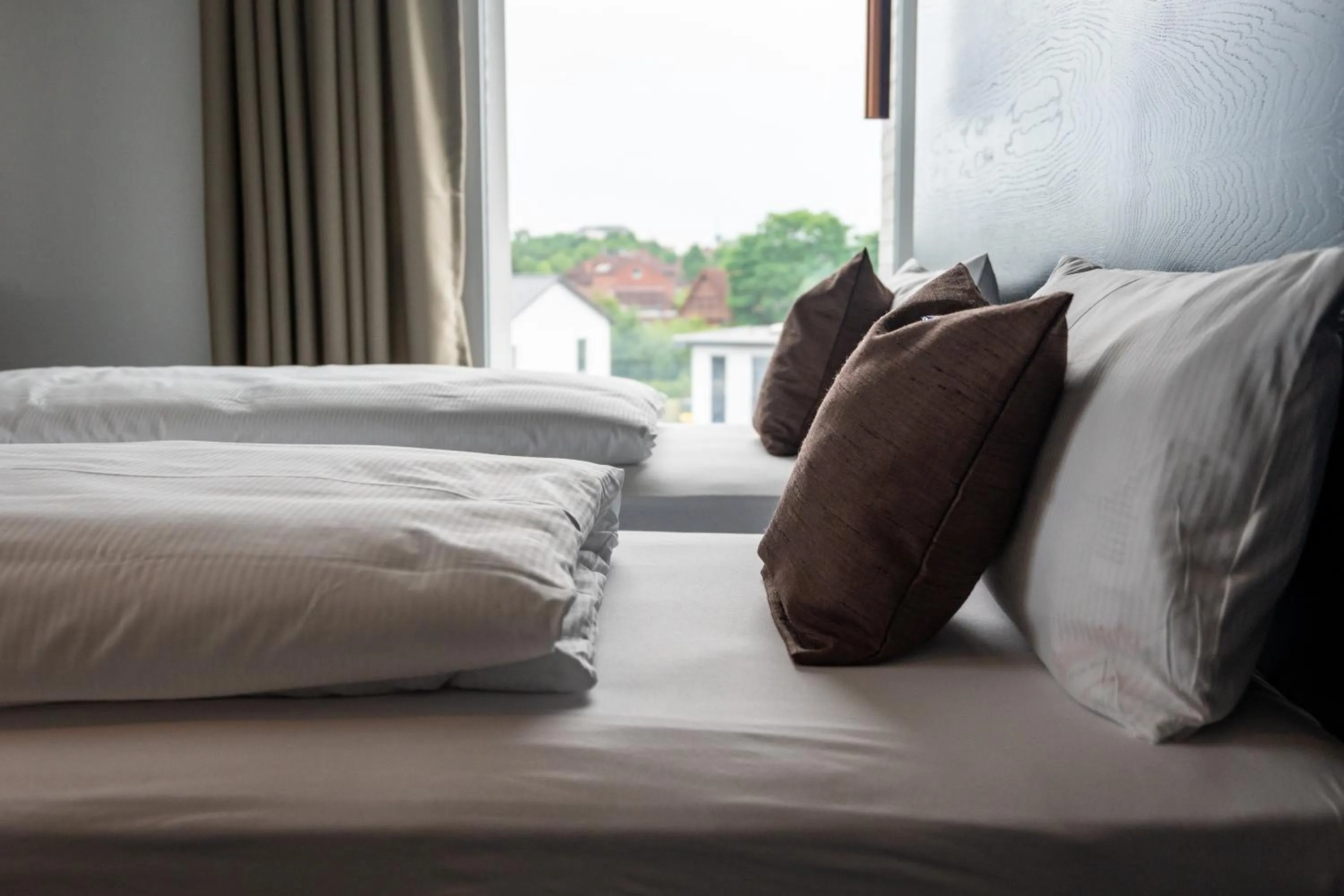 Bed in AKZENT Hotel DÉJANIL