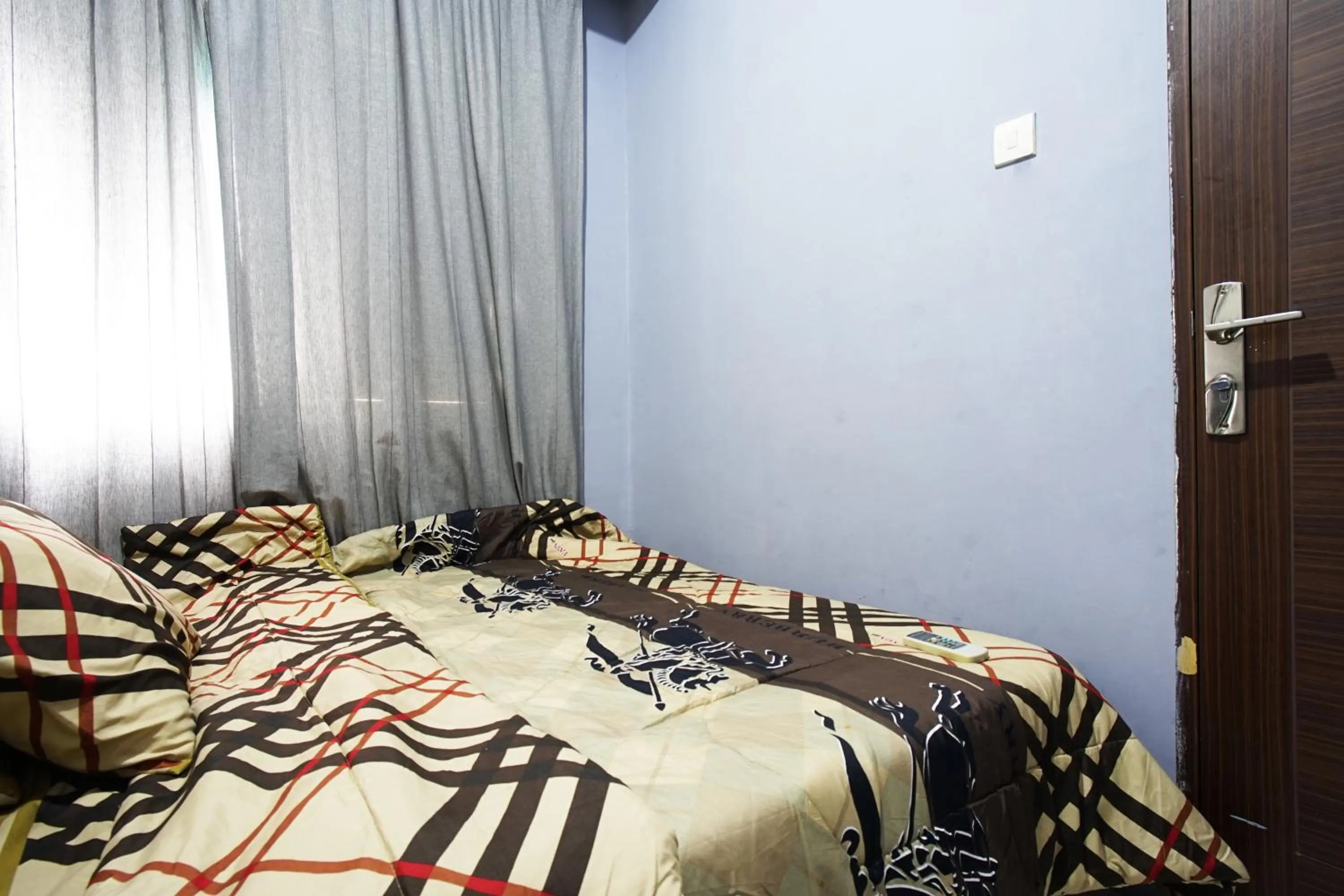 Bed in City Park Apartment by Anita