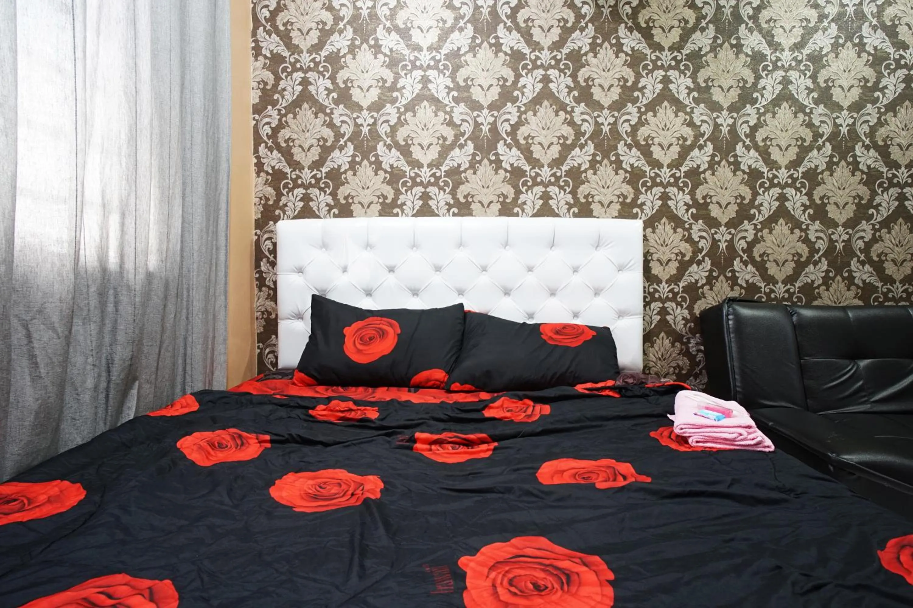 Bed in City Park Apartment by Anita