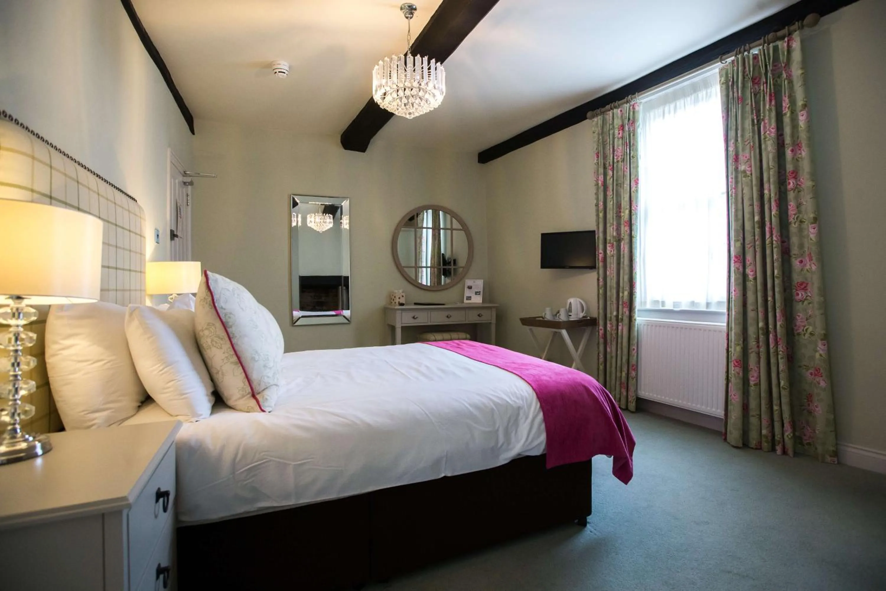 Bed in The Wyndham Hotel