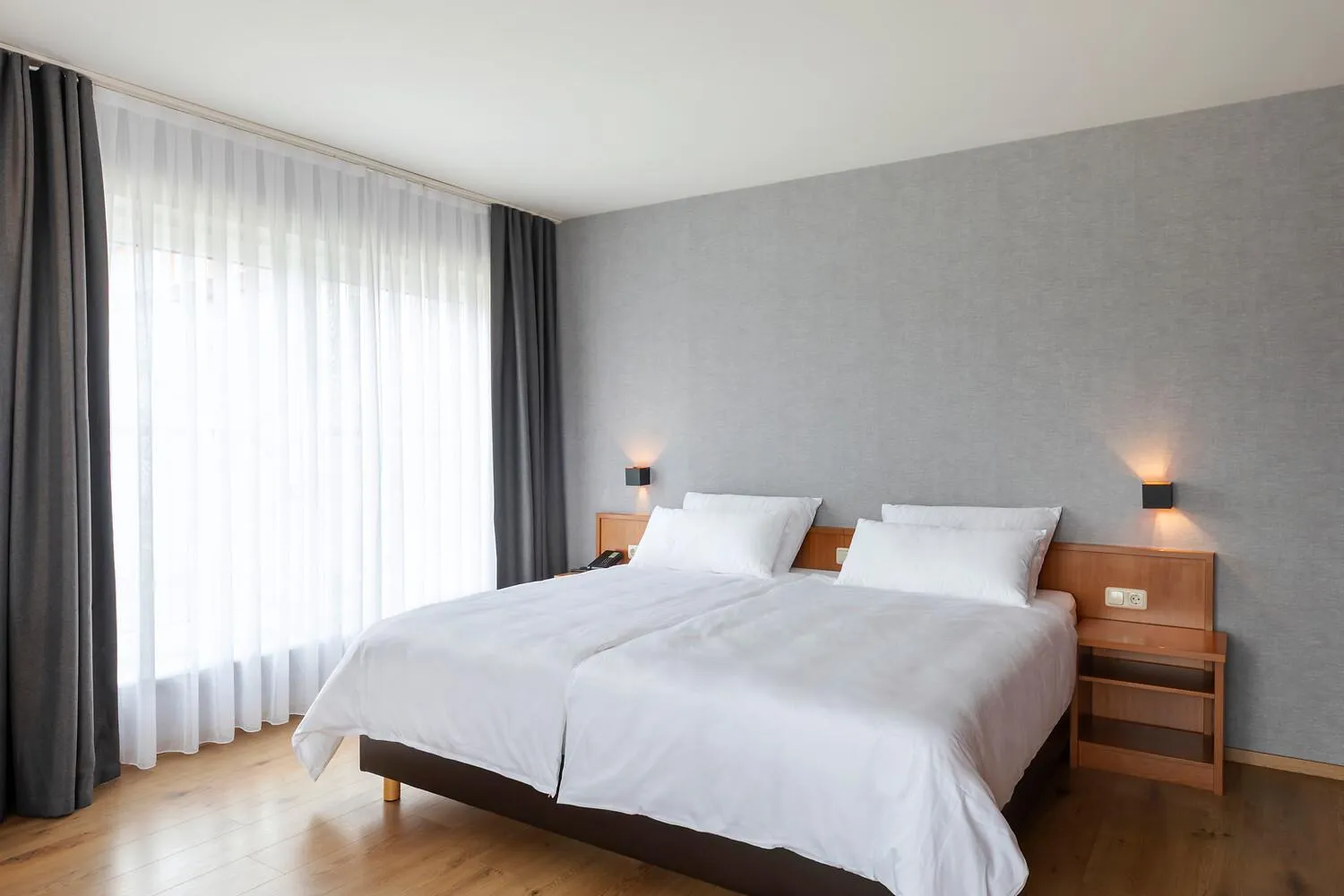 Bed in ACHAT Hotel Frankfurt Maintal