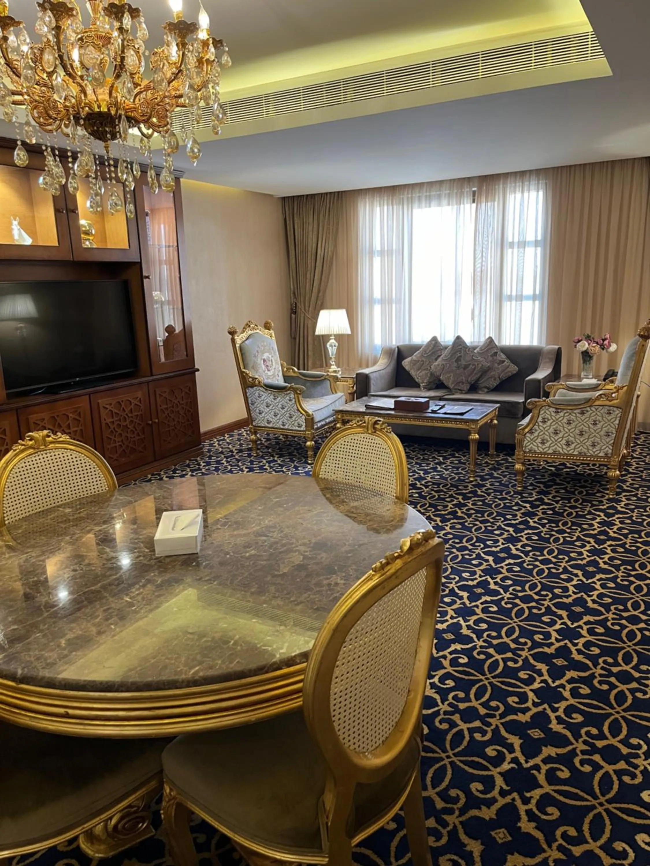 Communal lounge/ TV room in Al Rahden Hotel