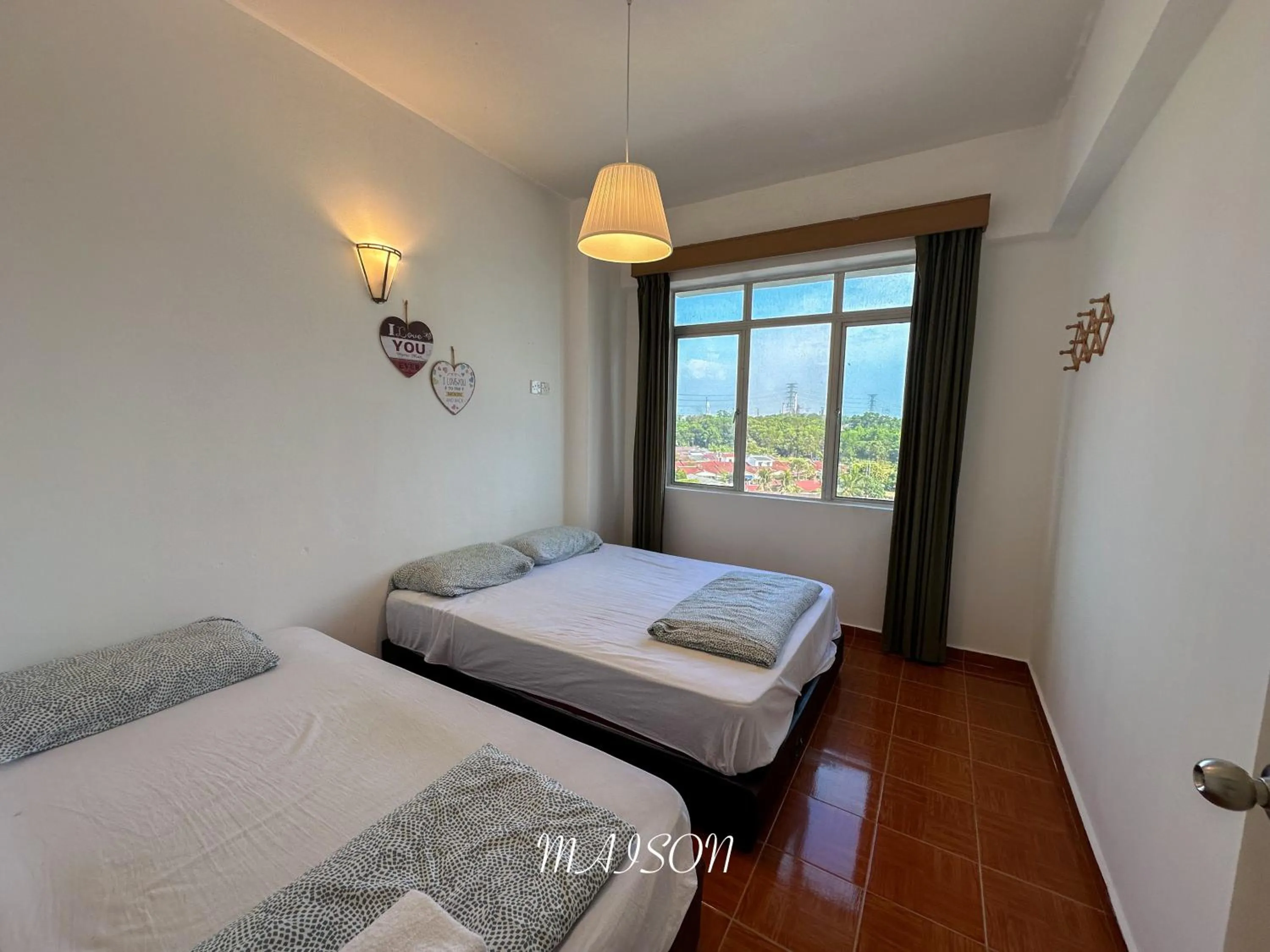 Bed in Maison Seaview Suites Port Dickson