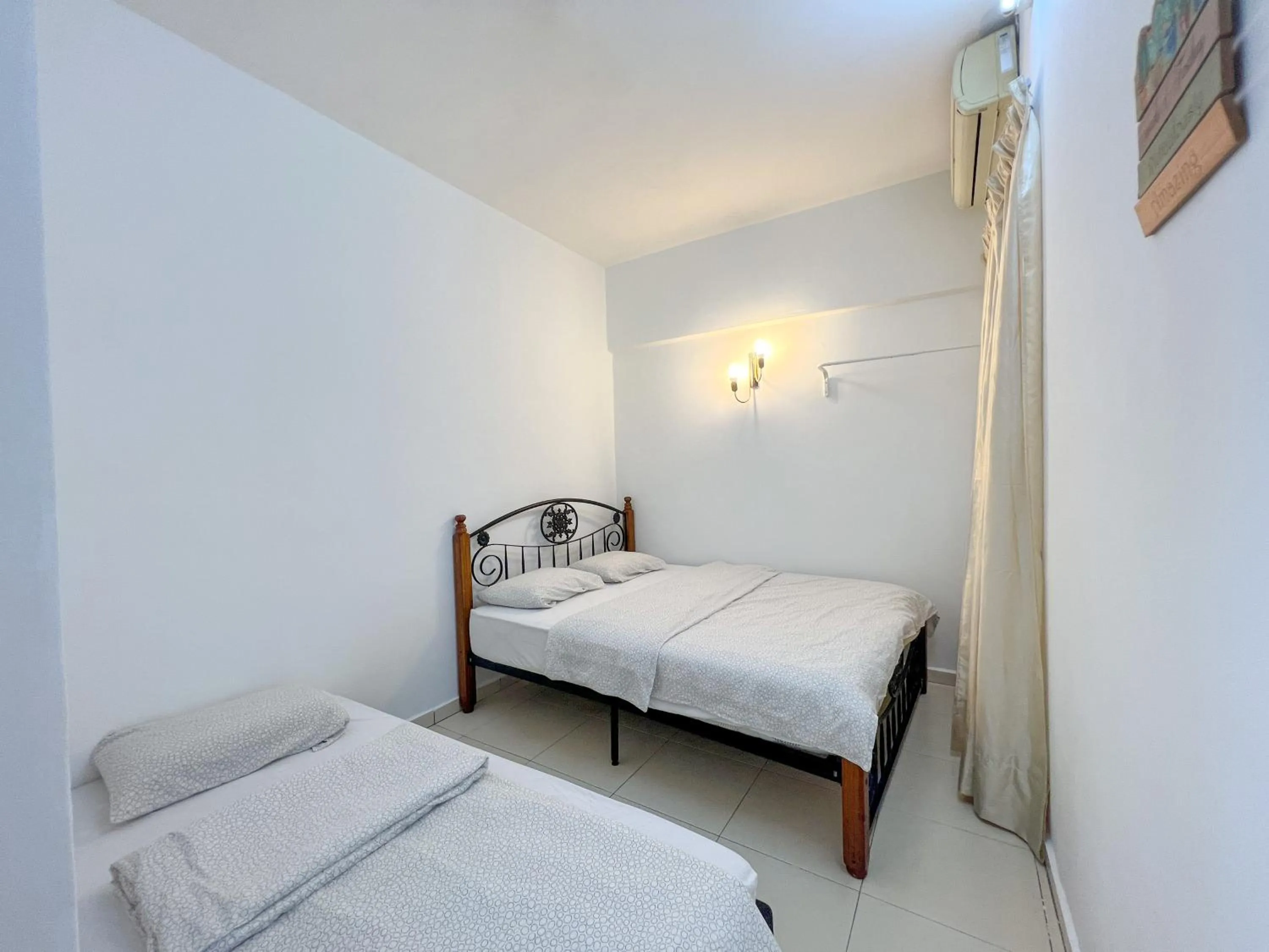 Bed in Maison Seaview Suites Port Dickson