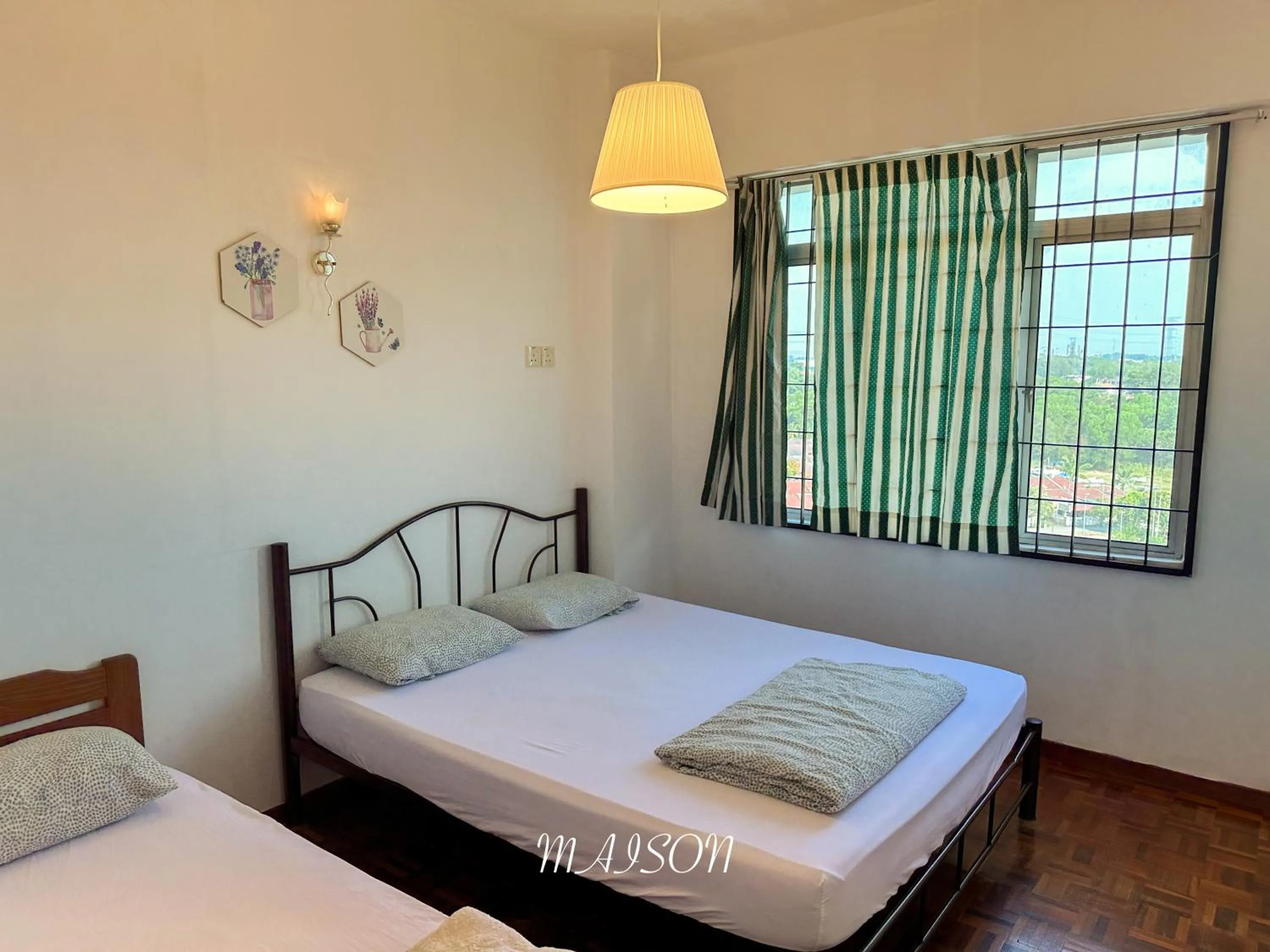 Bed in Maison Seaview Suites Port Dickson