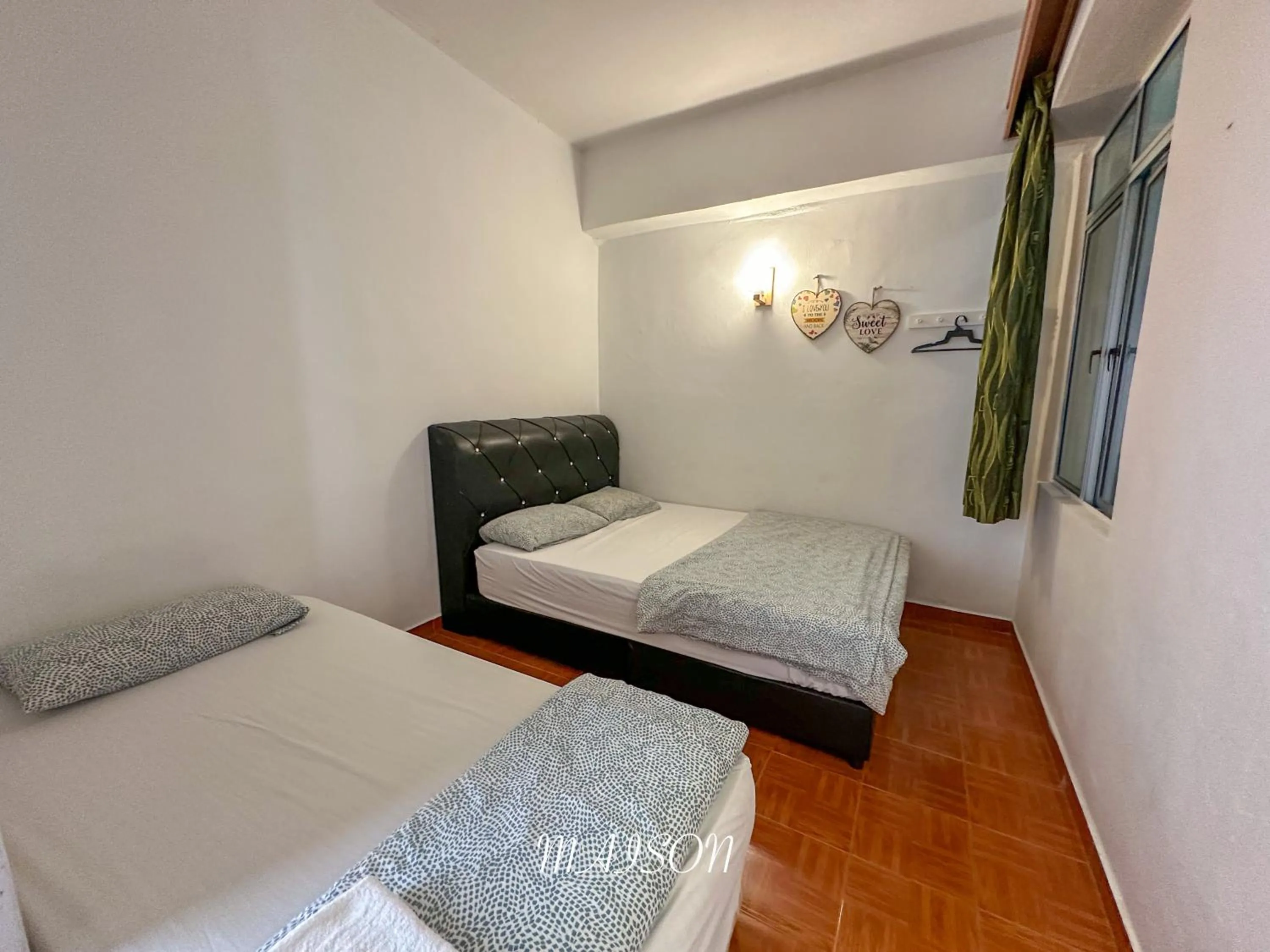 Bed in Maison Seaview Suites Port Dickson