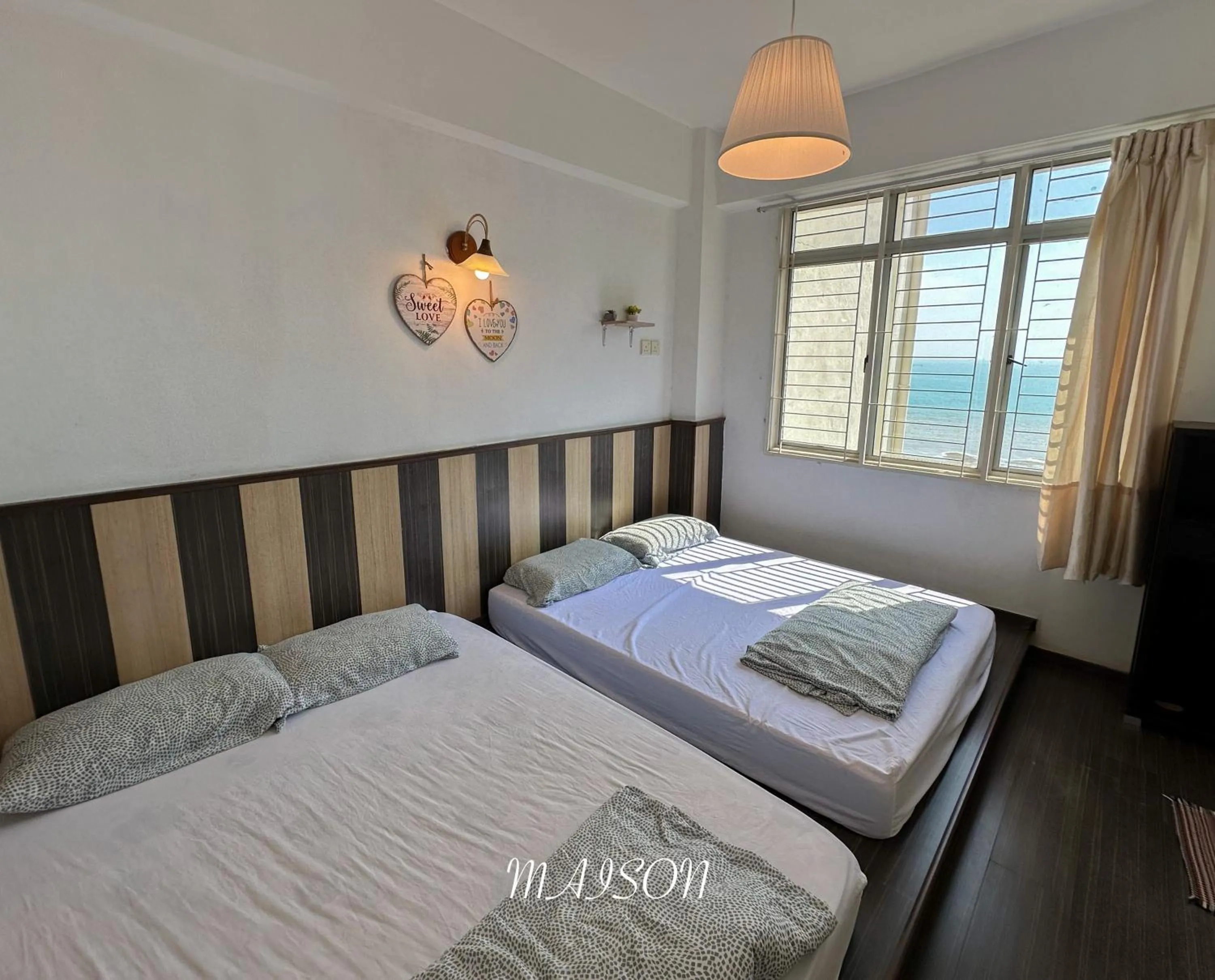 Bed in Maison Seaview Suites Port Dickson