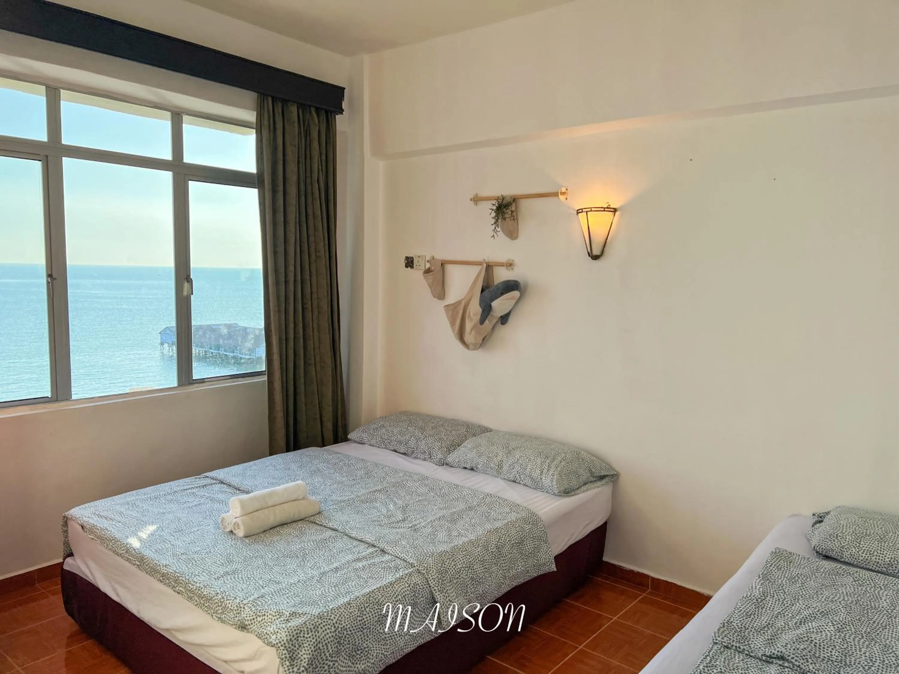 Bed in Maison Seaview Suites Port Dickson