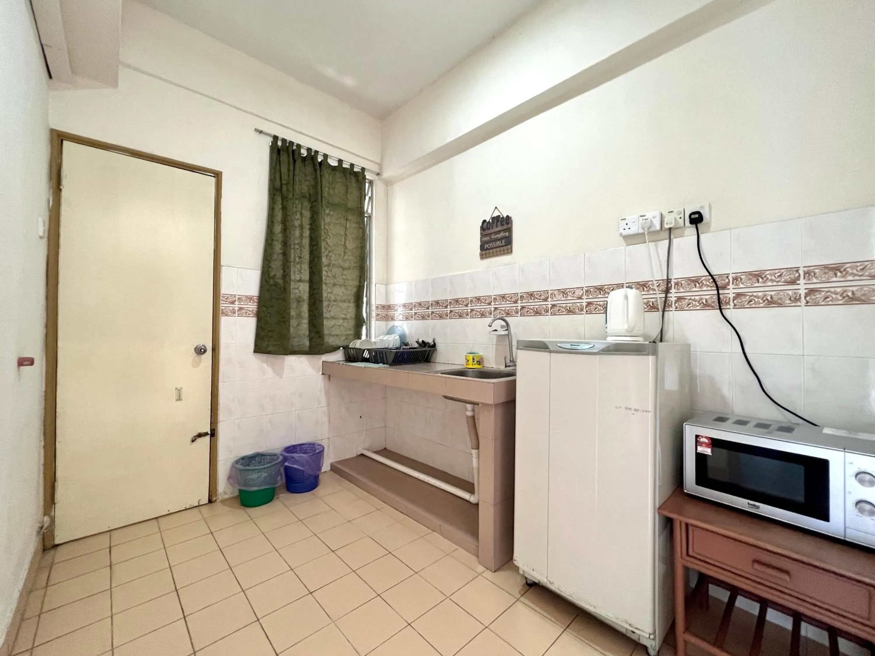 Communal lounge/ TV room in Maison Seaview Suites Port Dickson