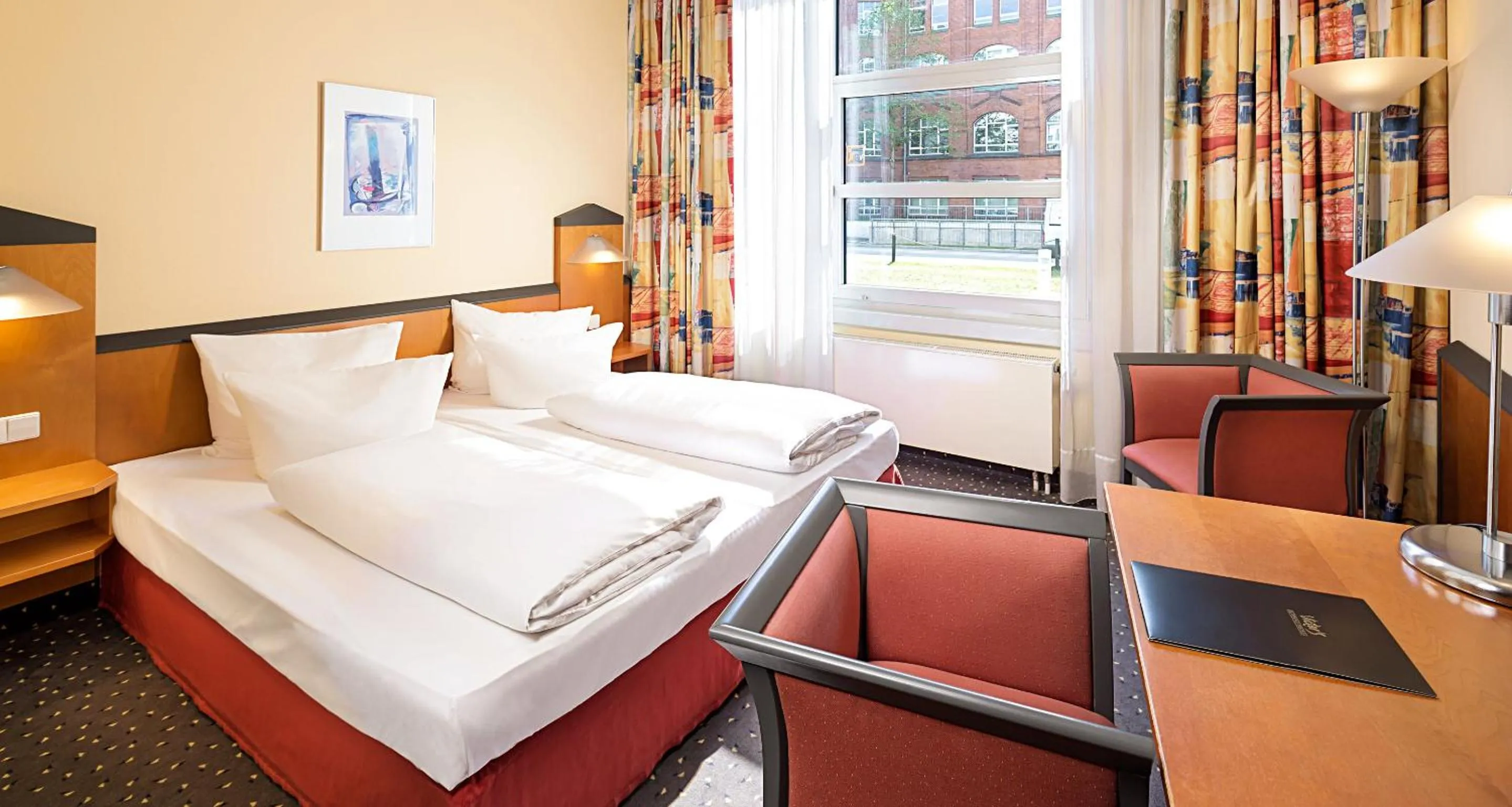 Bed in Victor's Residenz-Hotel Berlin Tegel