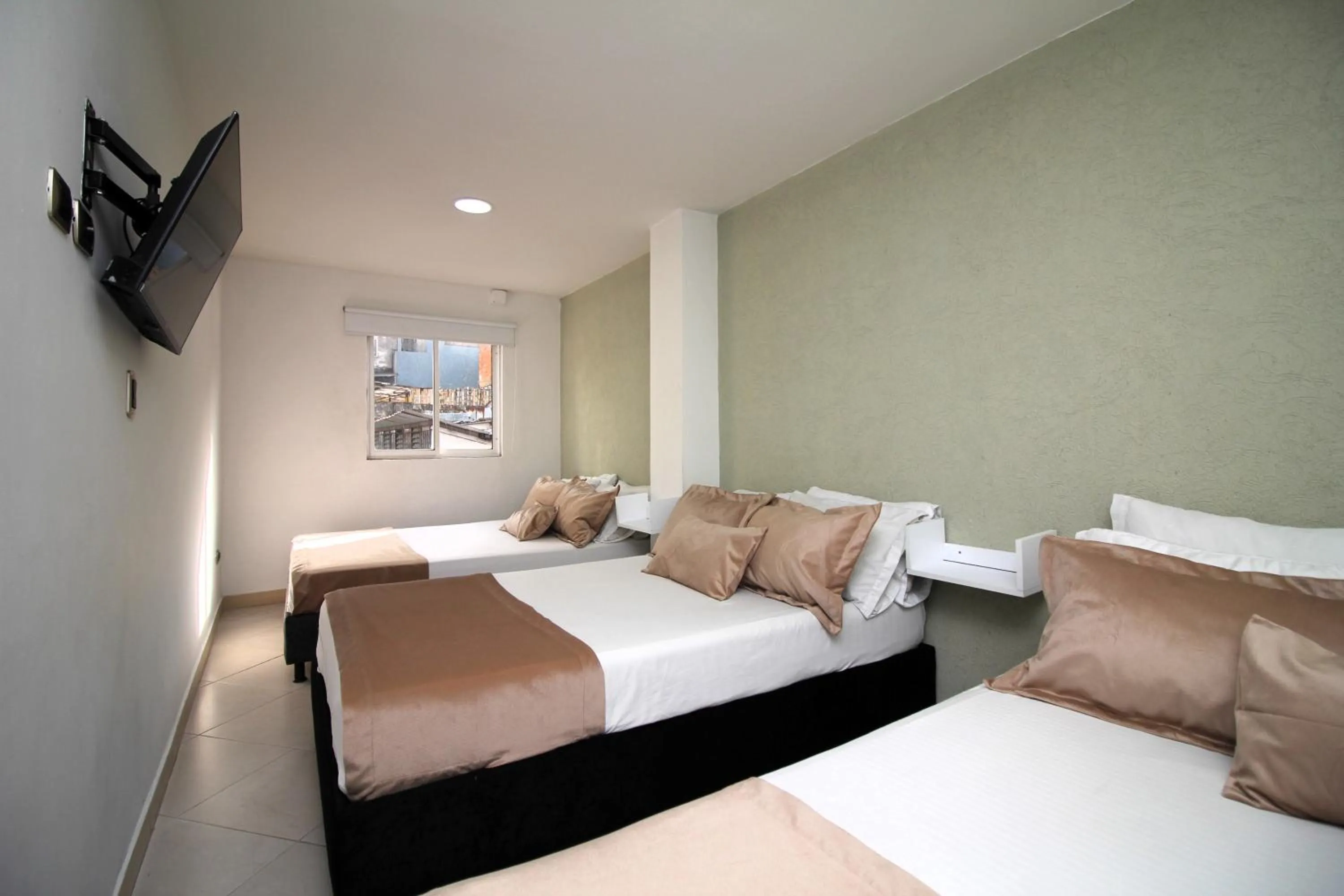 Bed in DAM Hotel Pereira