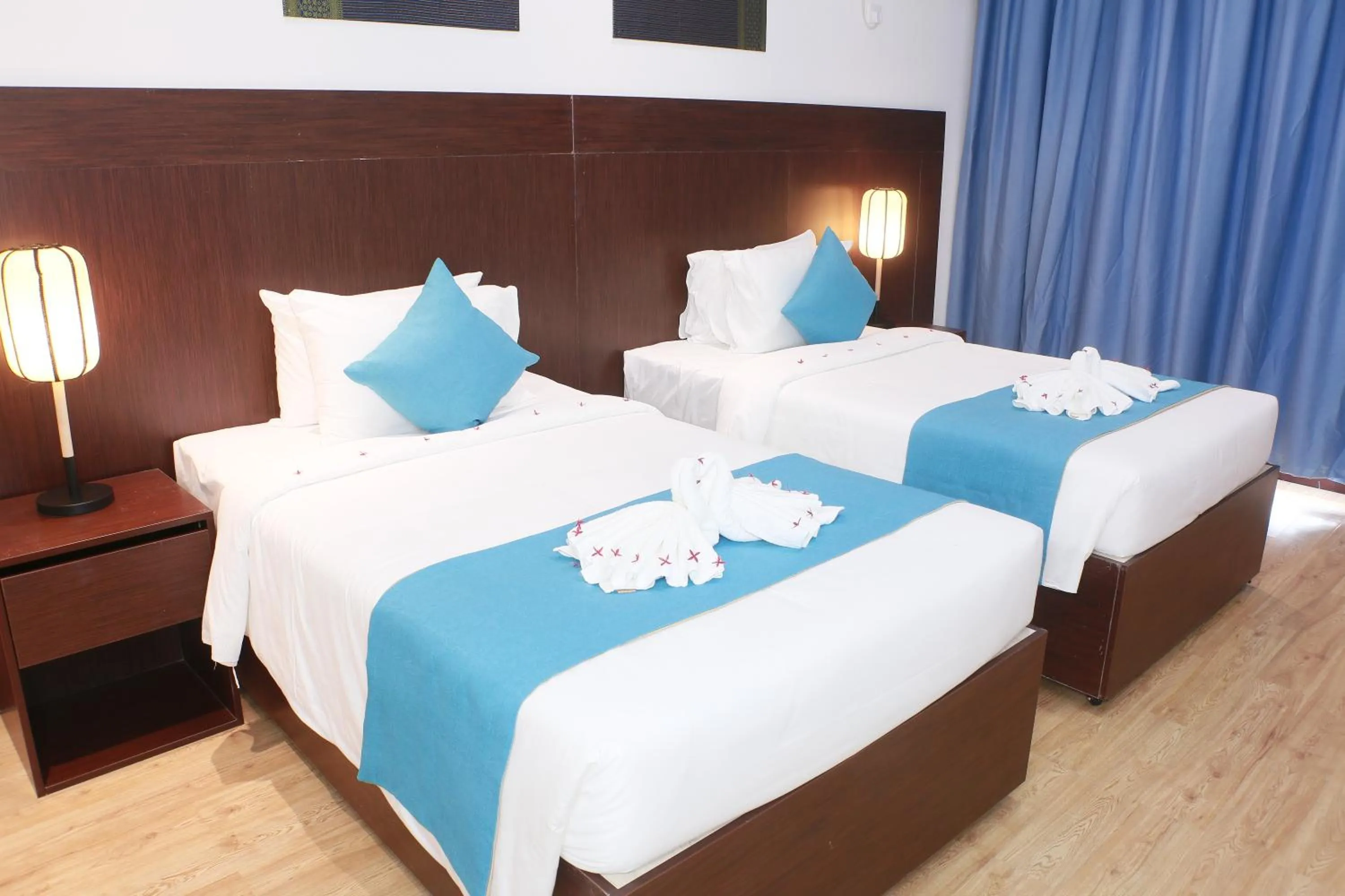 Bed in Sealong Bay ZhongQi Conifer Hotel 海龙湾中启康年酒店