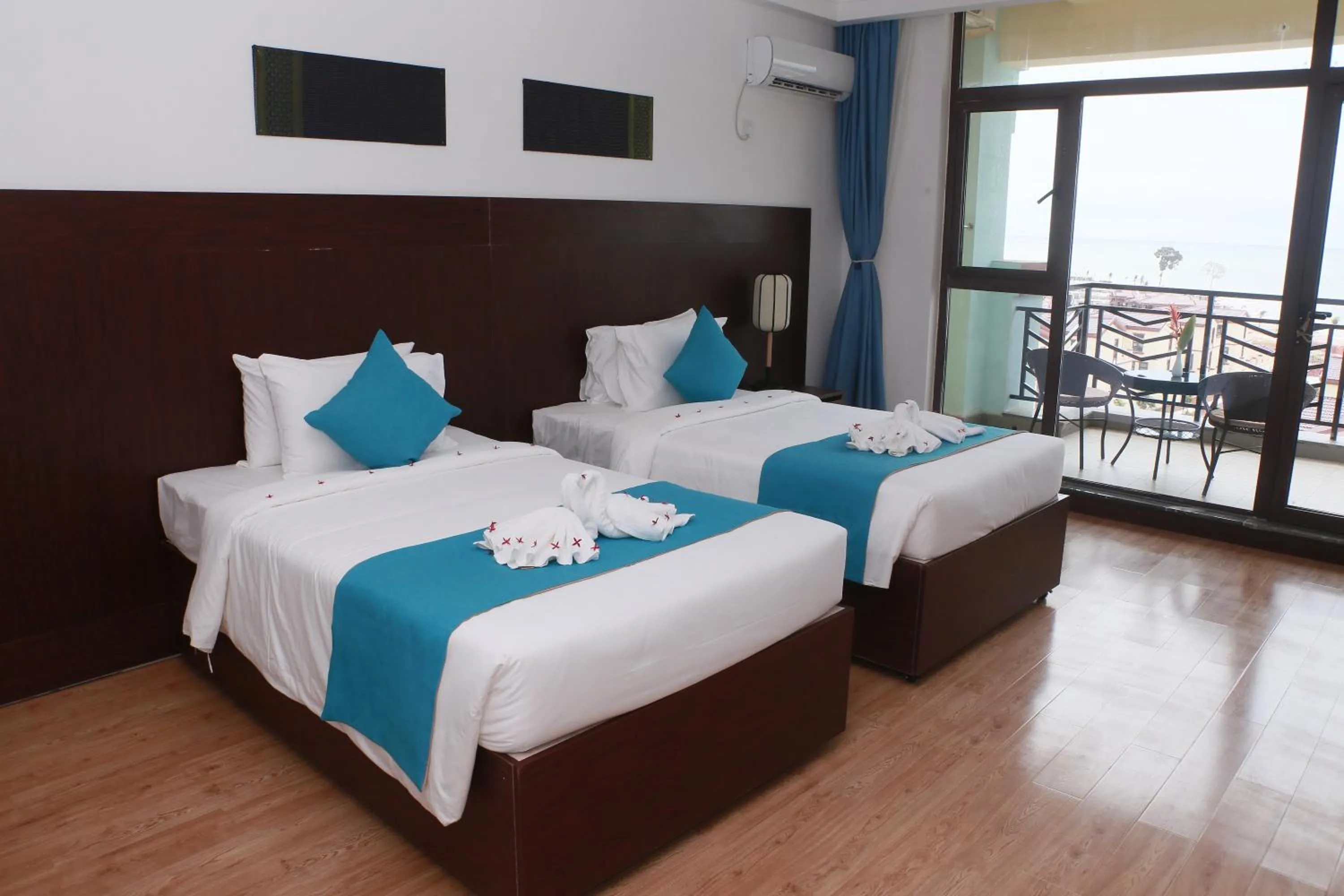 Bed in Sealong Bay ZhongQi Conifer Hotel 海龙湾中启康年酒店