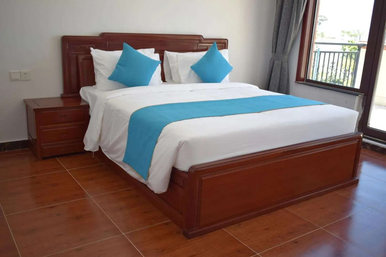 Bed in Sealong Bay ZhongQi Conifer Hotel 海龙湾中启康年酒店