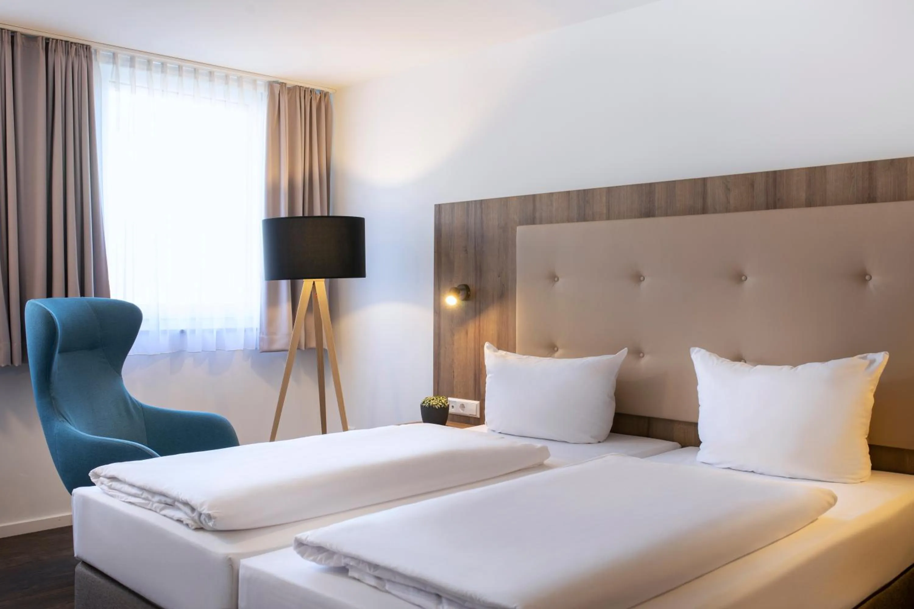 Photo of the whole room, Bed in ACHAT Hotel Stuttgart Zuffenhausen