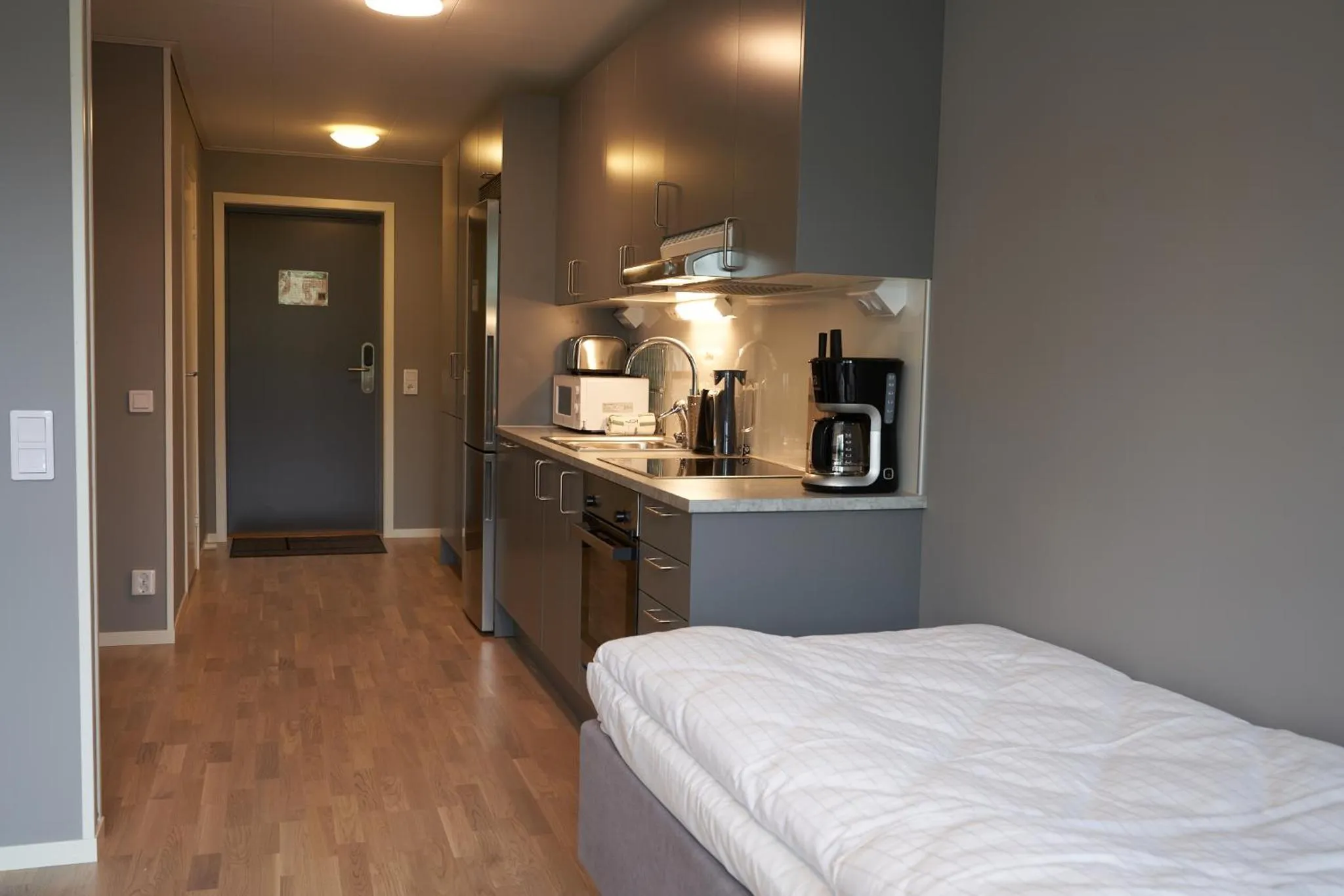 Kitchen or kitchenette, Bed in Ekebyhov Hotell