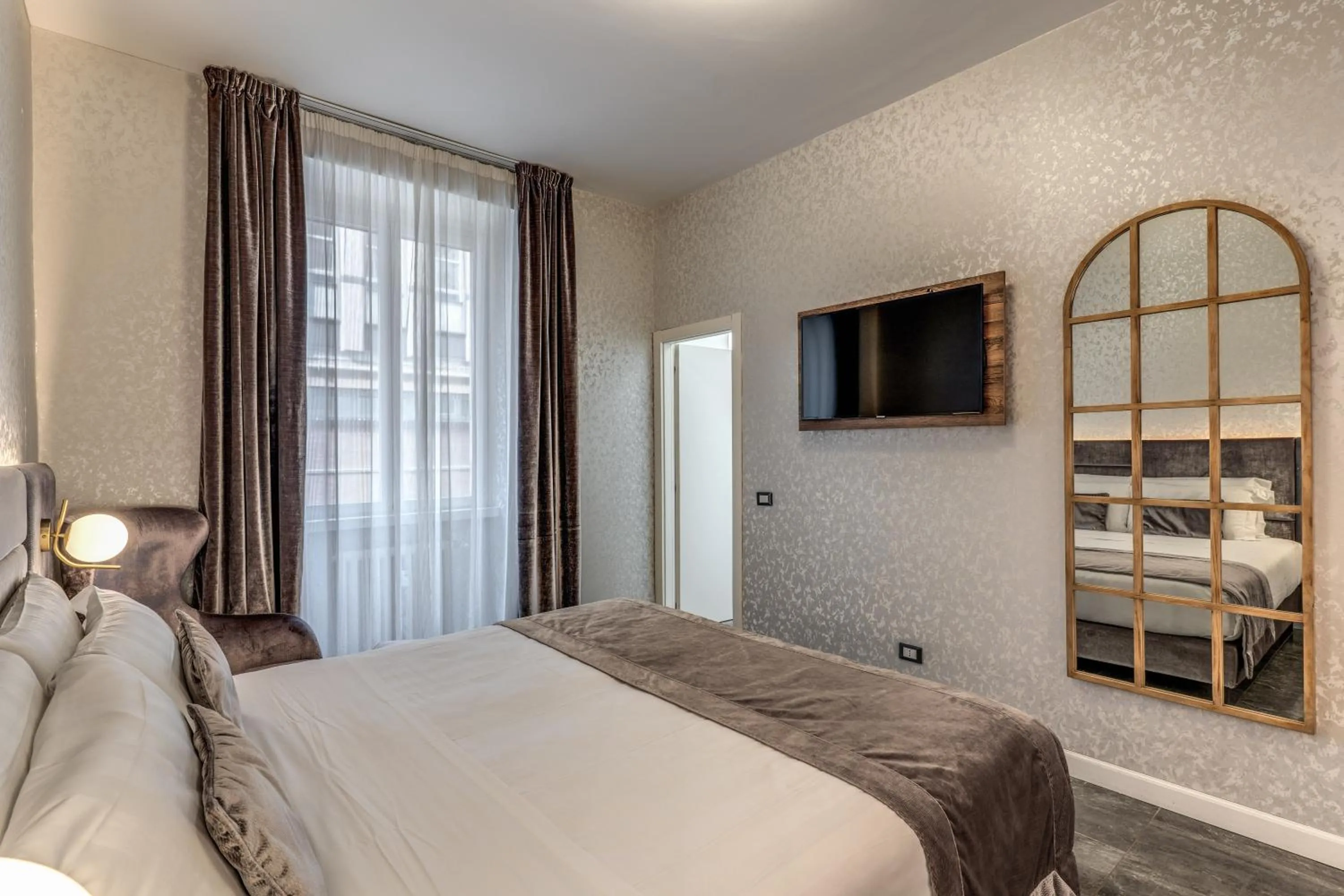 Bed in Apollo Boutique Hotel