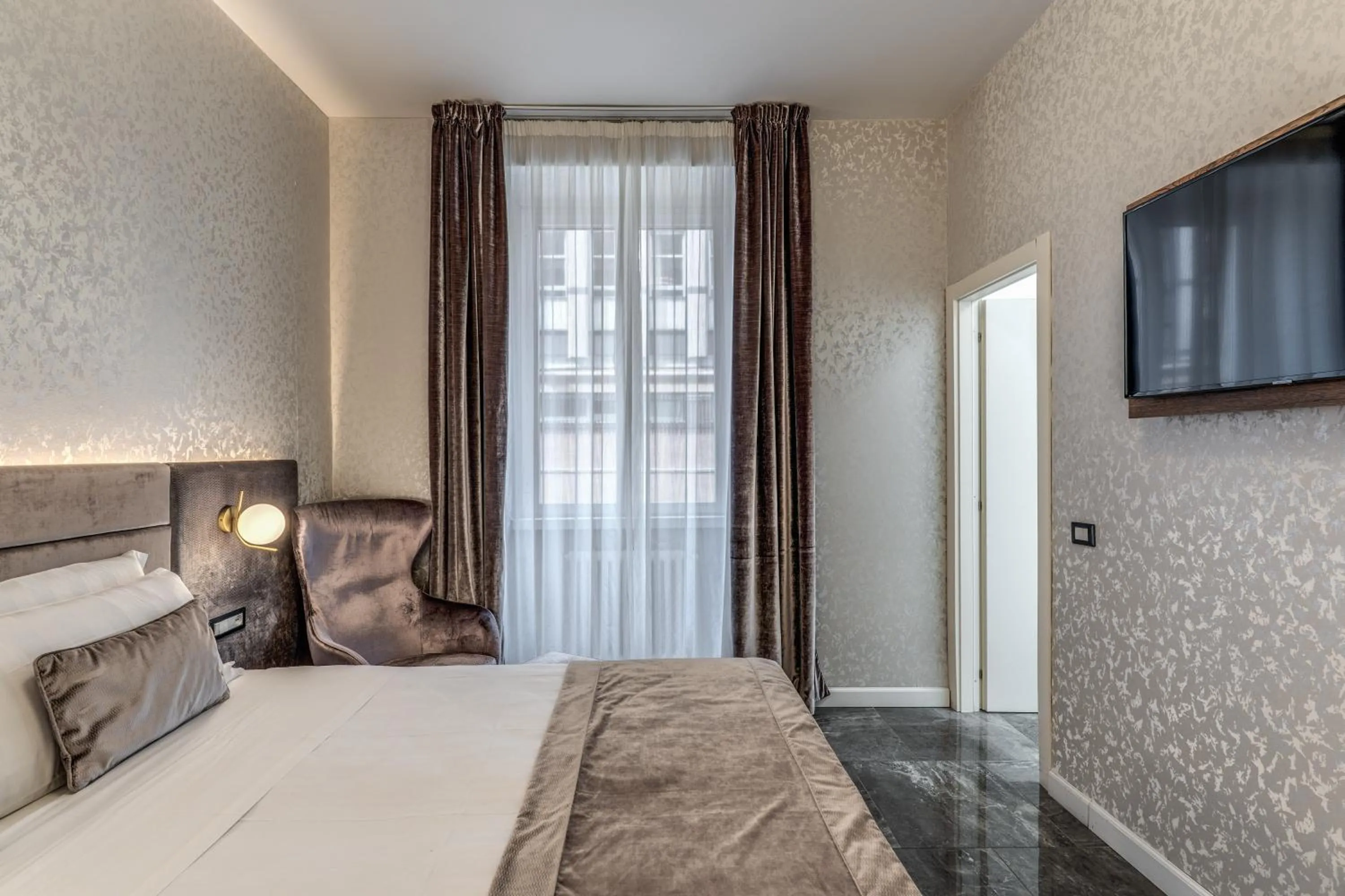 Bed in Apollo Boutique Hotel