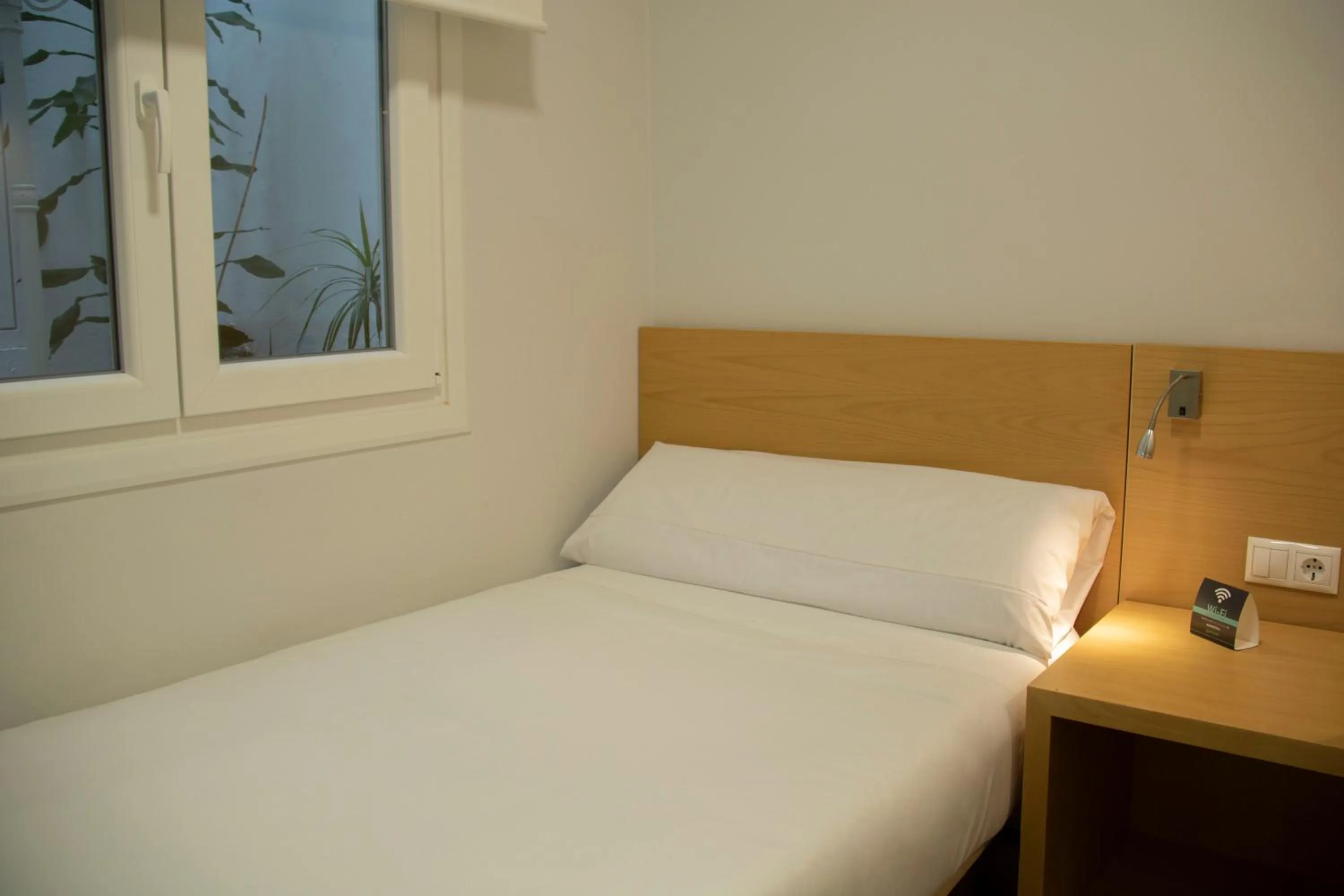 Bed in Alda Alborán Rooms