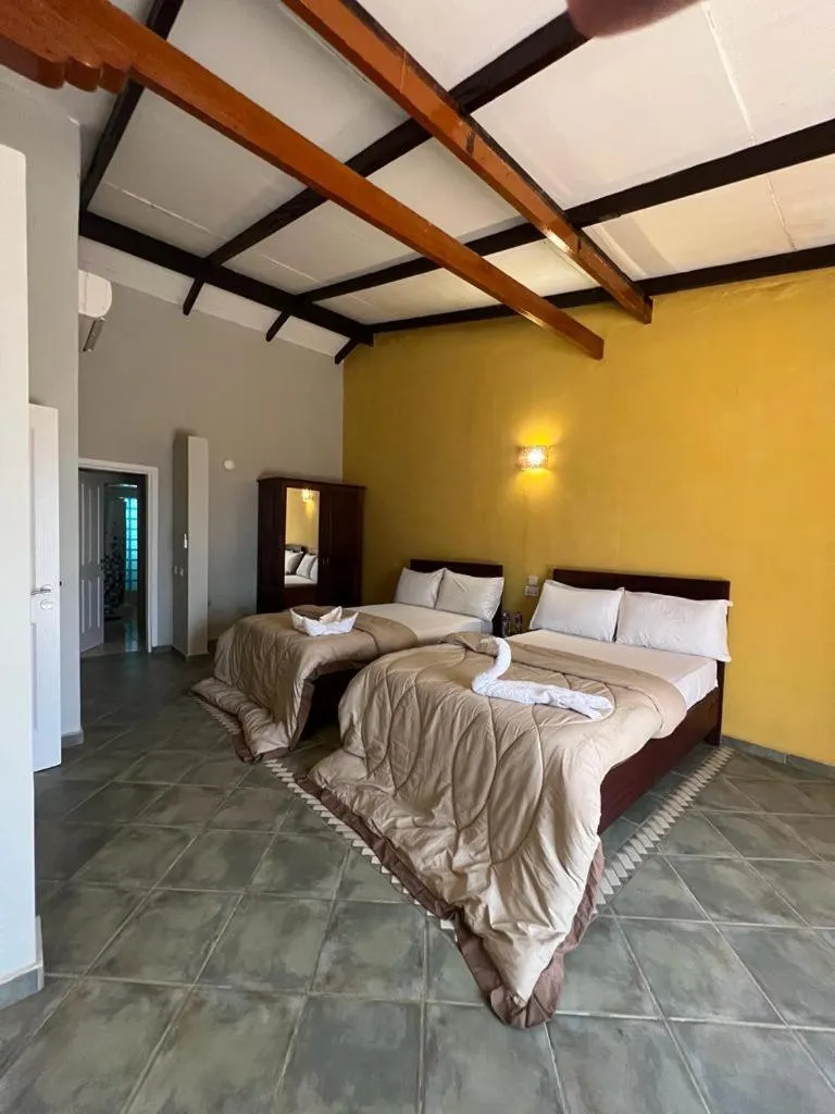 Bed in Tropic Garden Hotel