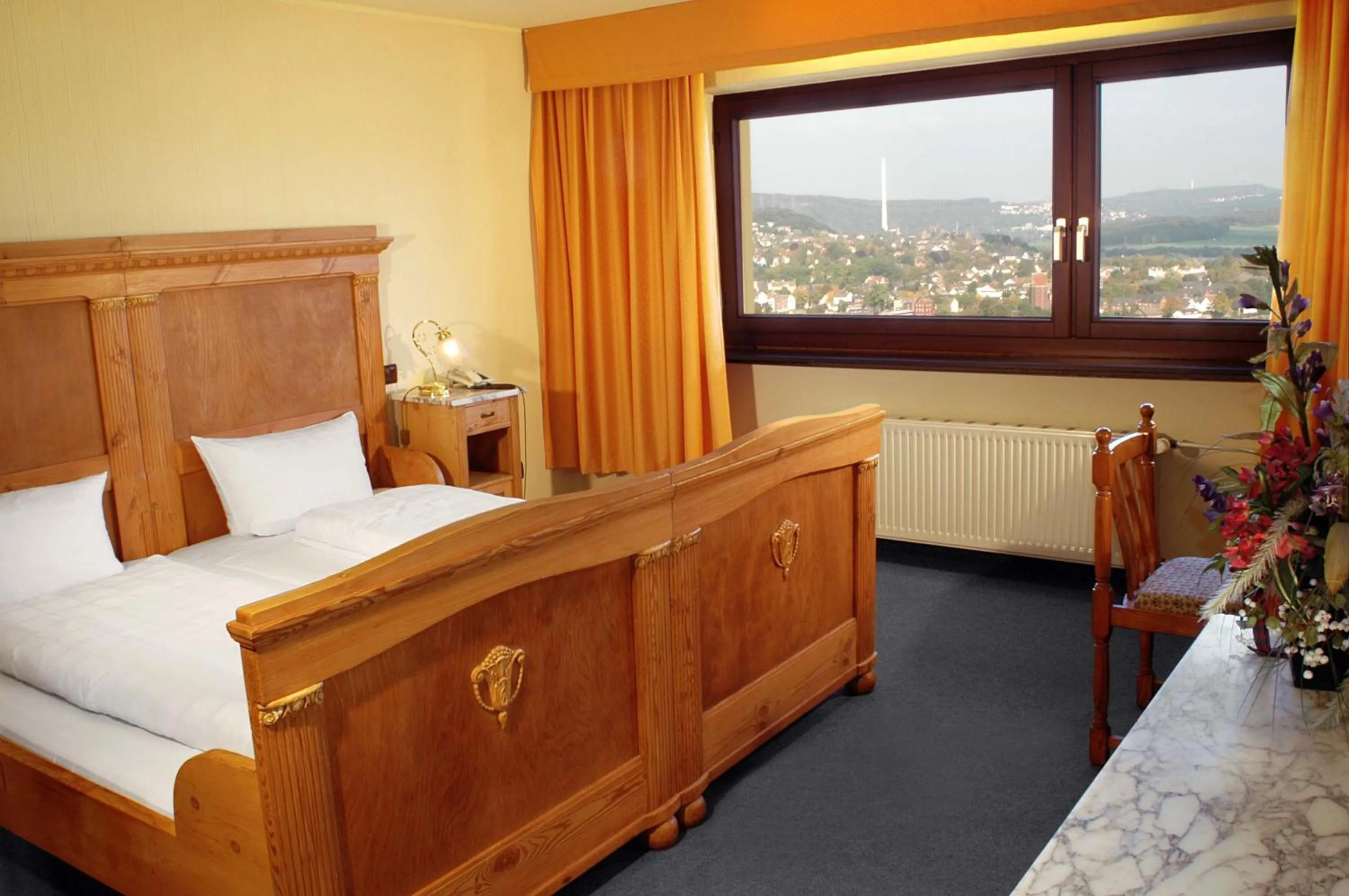 Photo of the whole room, Bed in Burghotel Volmarstein