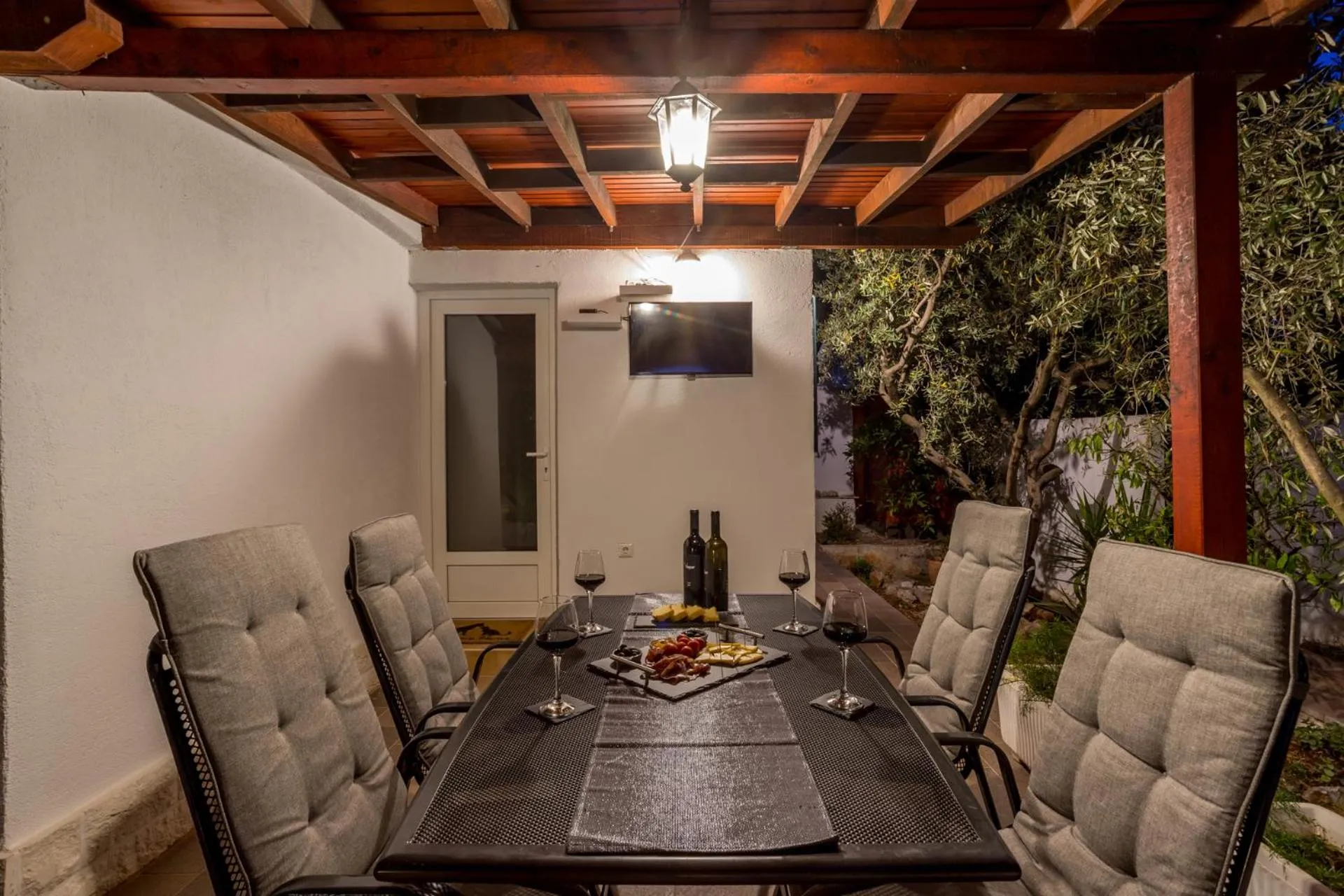 Seating Area in House with big walled oliva garden