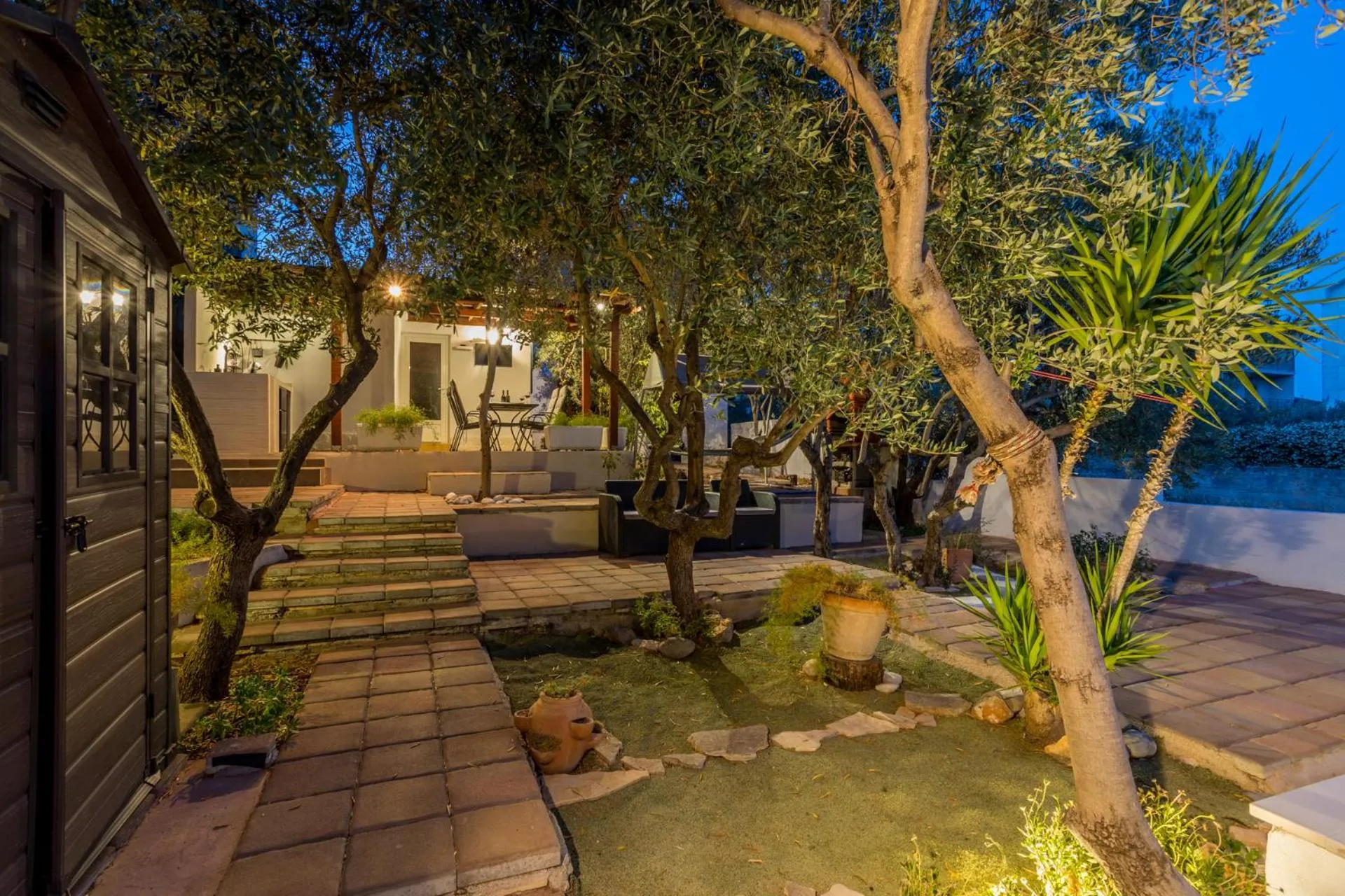 House with big walled oliva garden