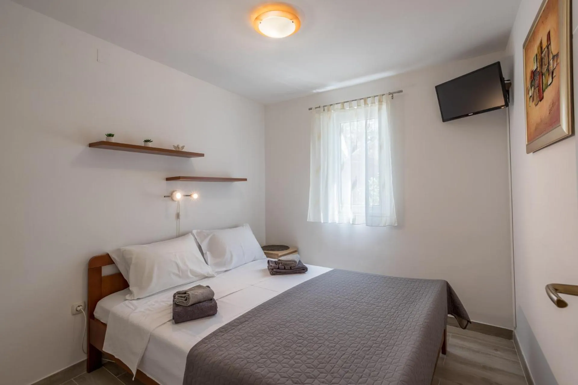 TV/Entertainment Center in House with big walled oliva garden