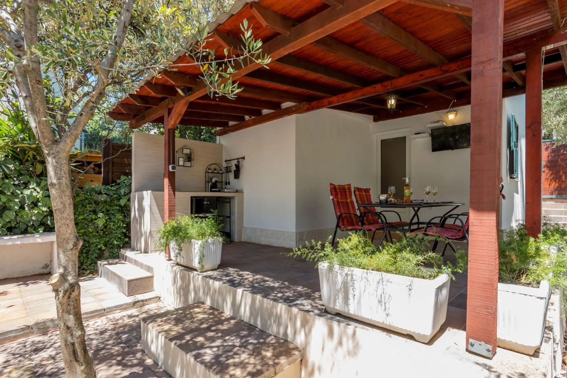 House with big walled oliva garden