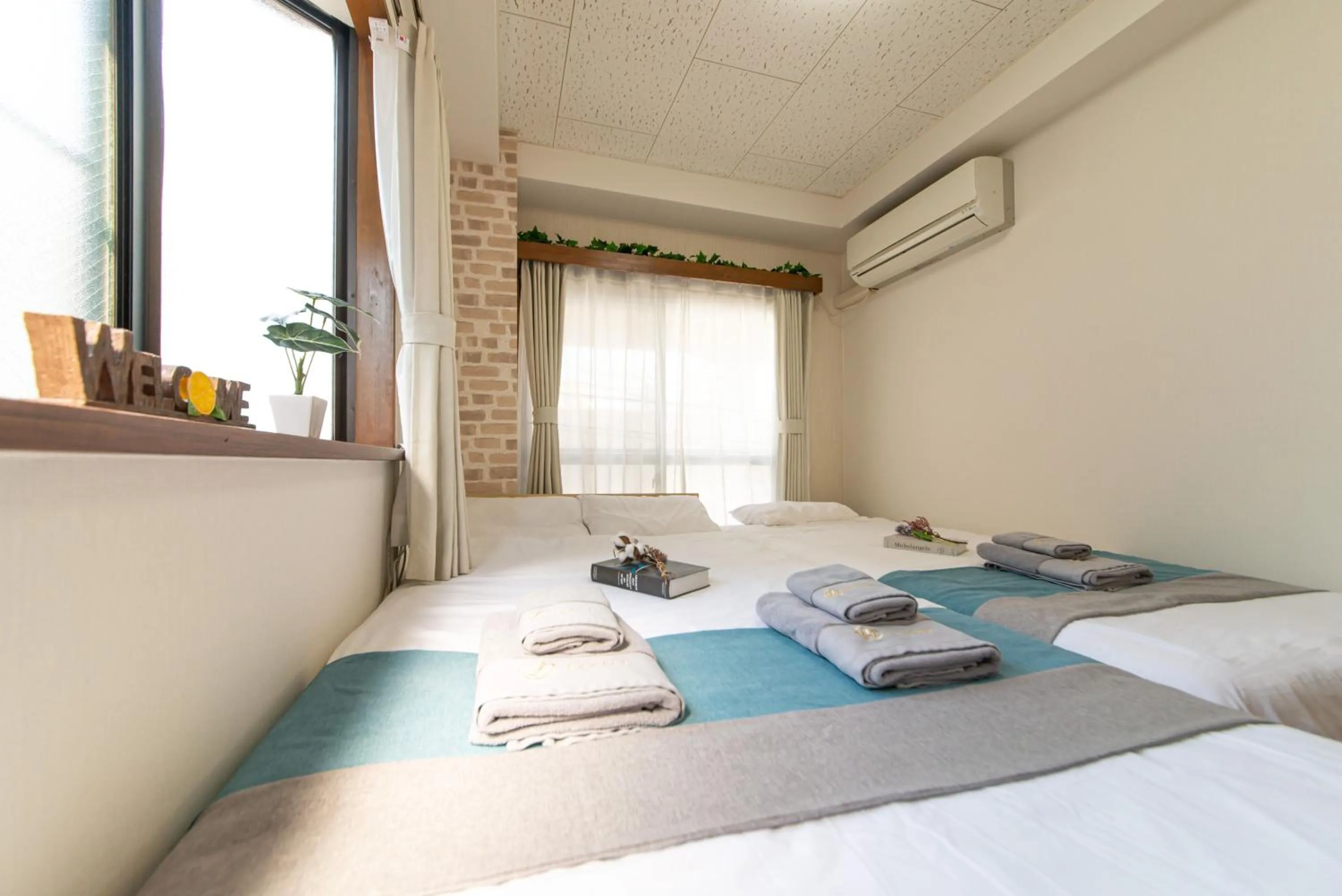 Bed in nestay suite tokyo tabata