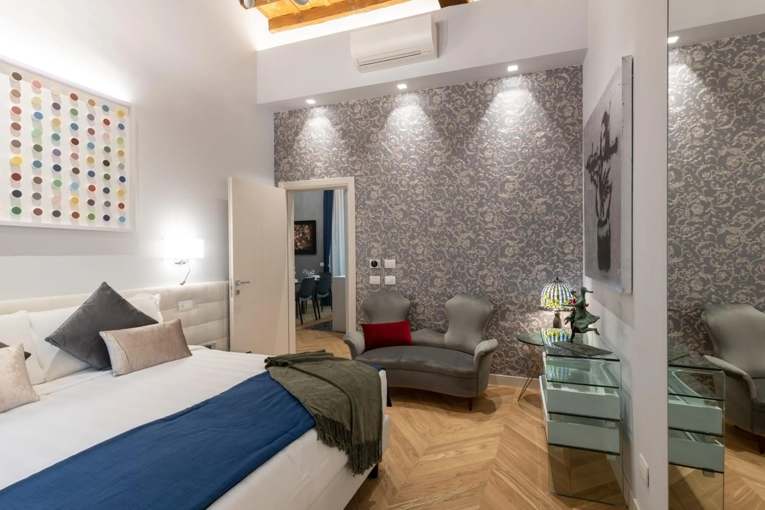 Seating area, Bed in Kairos by Florence Art Apartments