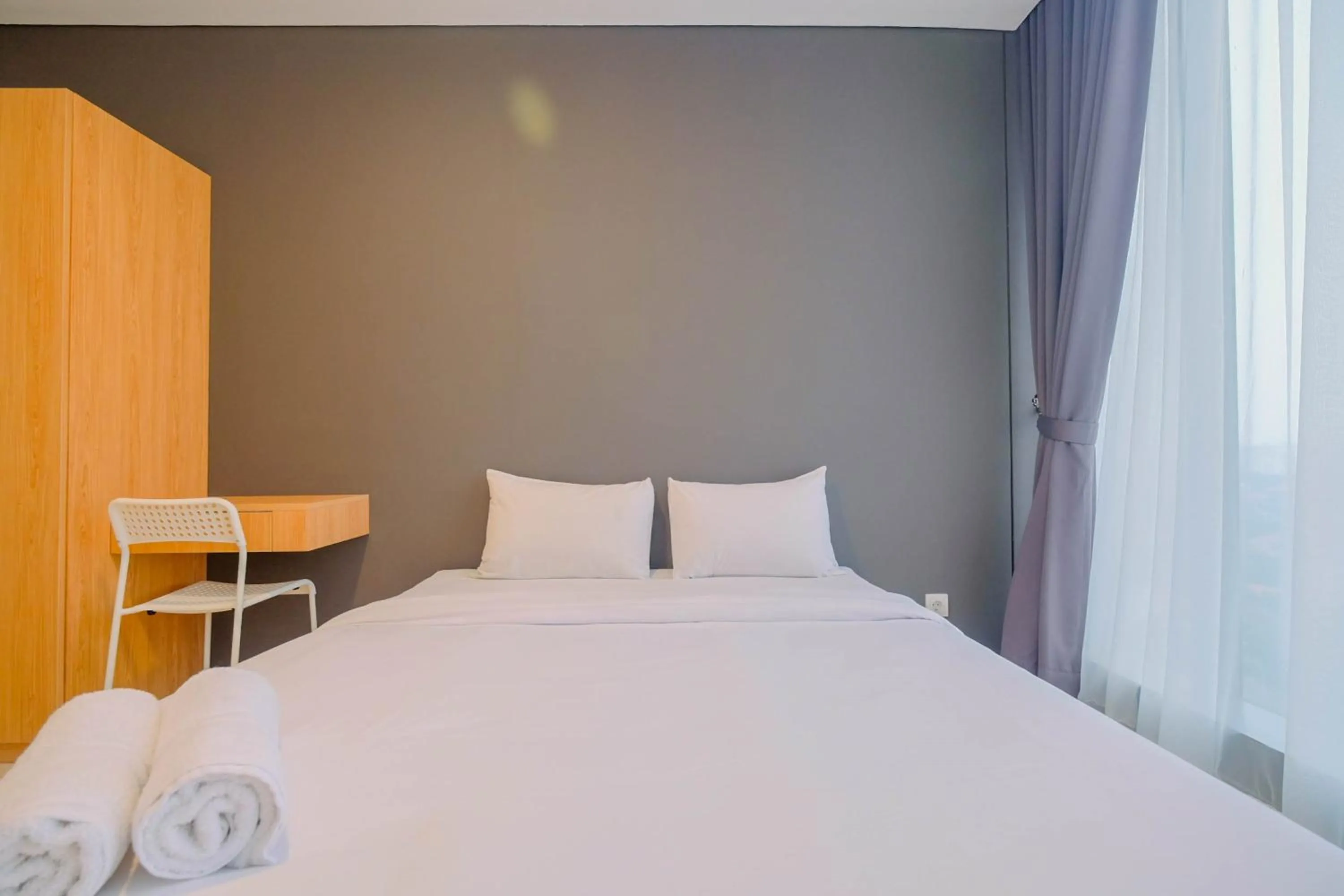 Modern and Spacious 2BR L'Avenue Apartment By Travelio