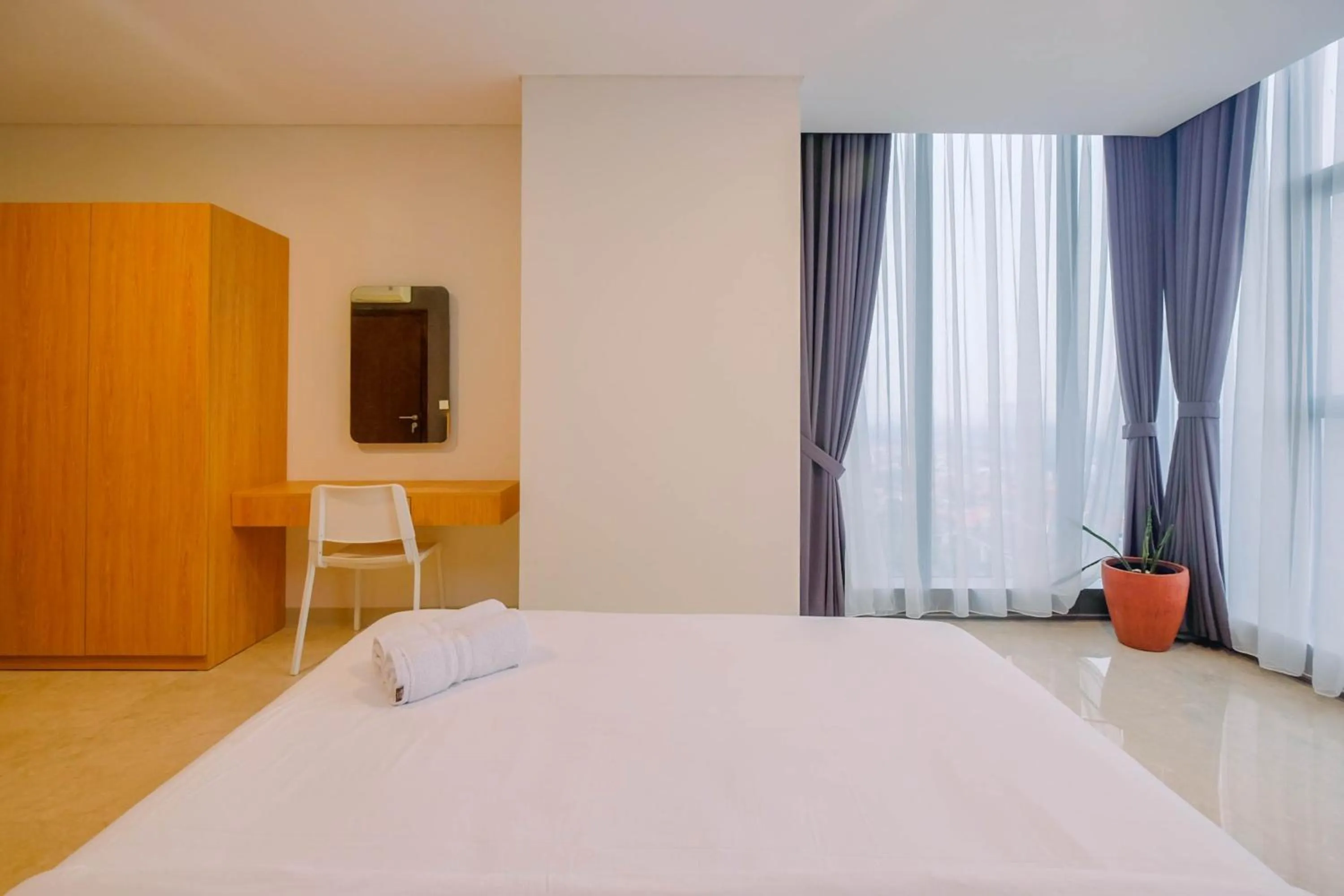 Modern and Spacious 2BR L'Avenue Apartment By Travelio