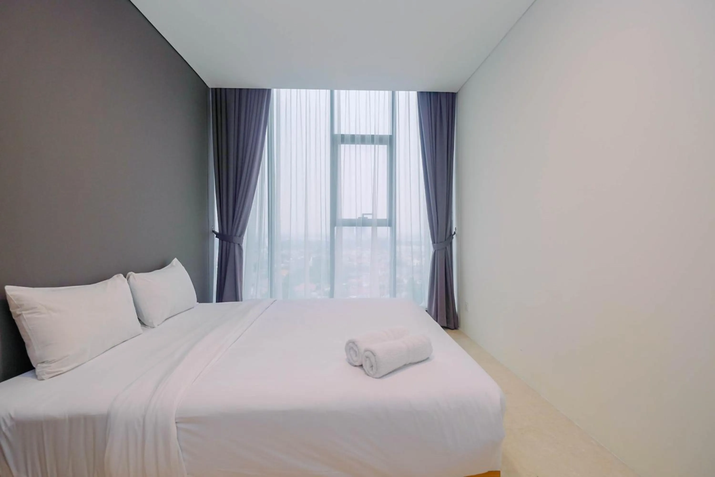 Modern and Spacious 2BR L'Avenue Apartment By Travelio